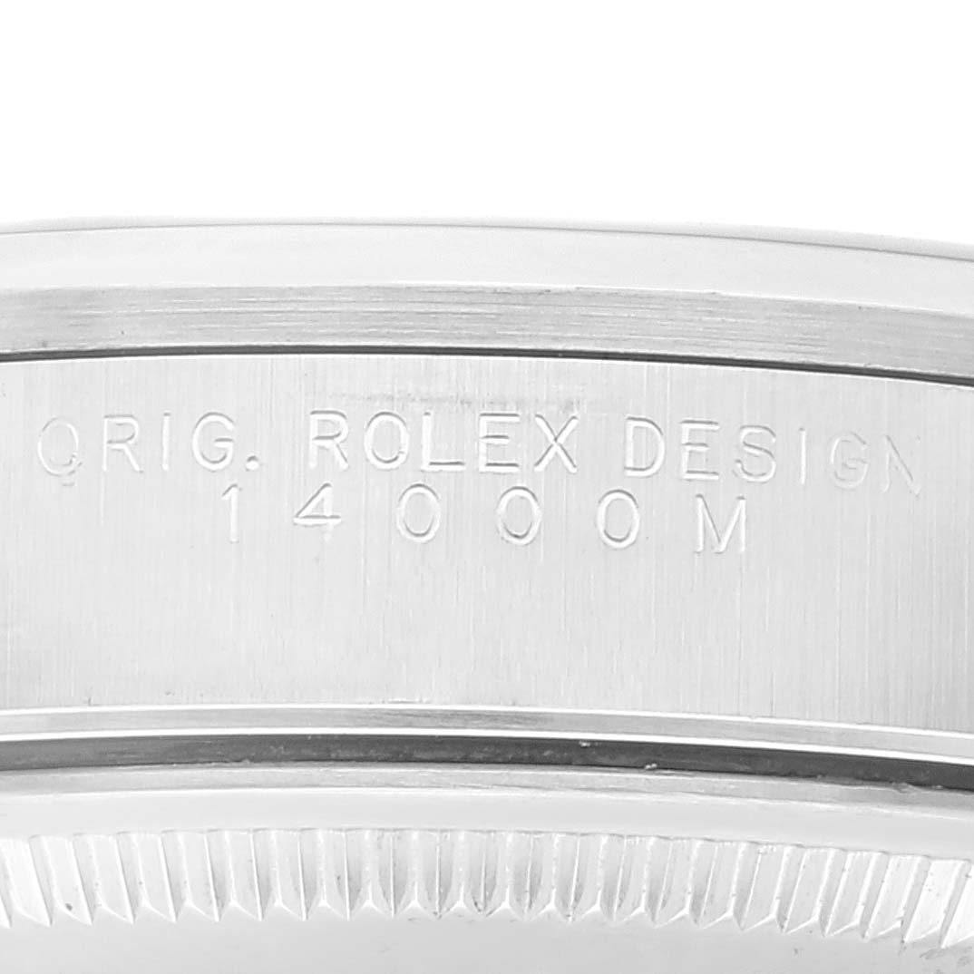 Close-up of the side of the Rolex Air-King 14000 Men's Stainless Steel Silver Dial 14000 Men's Stainless Steel Silver Dial watch case, showing the model number and "ORIG. ROLEX DESIGN" engraving.