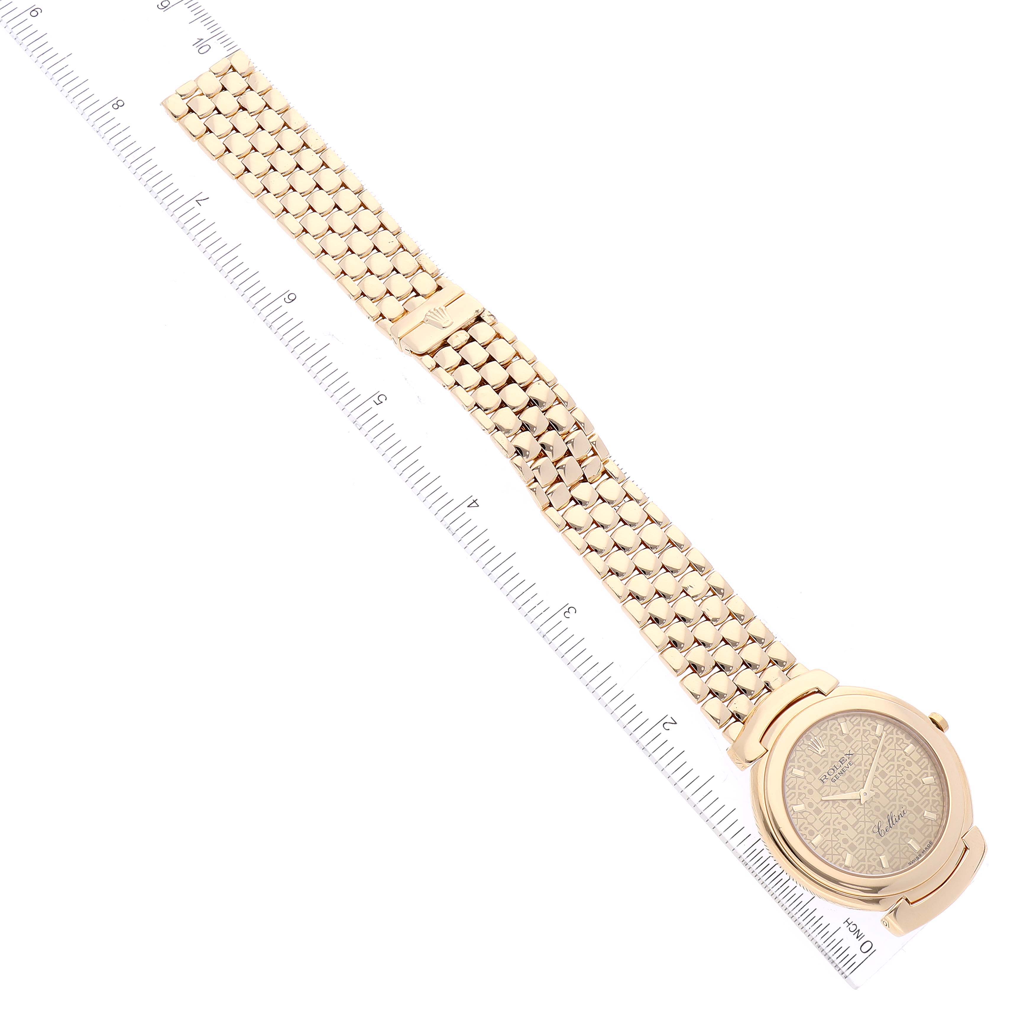 The image shows a top-down view of a Rolex Cellini 6623 Men
s Yellow Gold Champagne Dial 6623 Men
s Yellow Gold Champagne Dial watch, displaying the face, bezel, case, and integrated bracelet alongside a ruler.