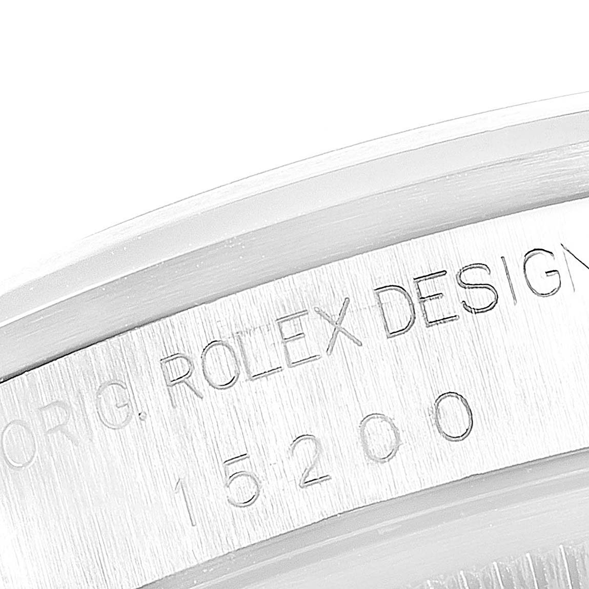 This image shows a close-up of the engraved case side of a Rolex Datejust 15200 Men's Stainless Steel Blue Dial 15200 Men's Stainless Steel Blue Dial model with the design and model number visible.