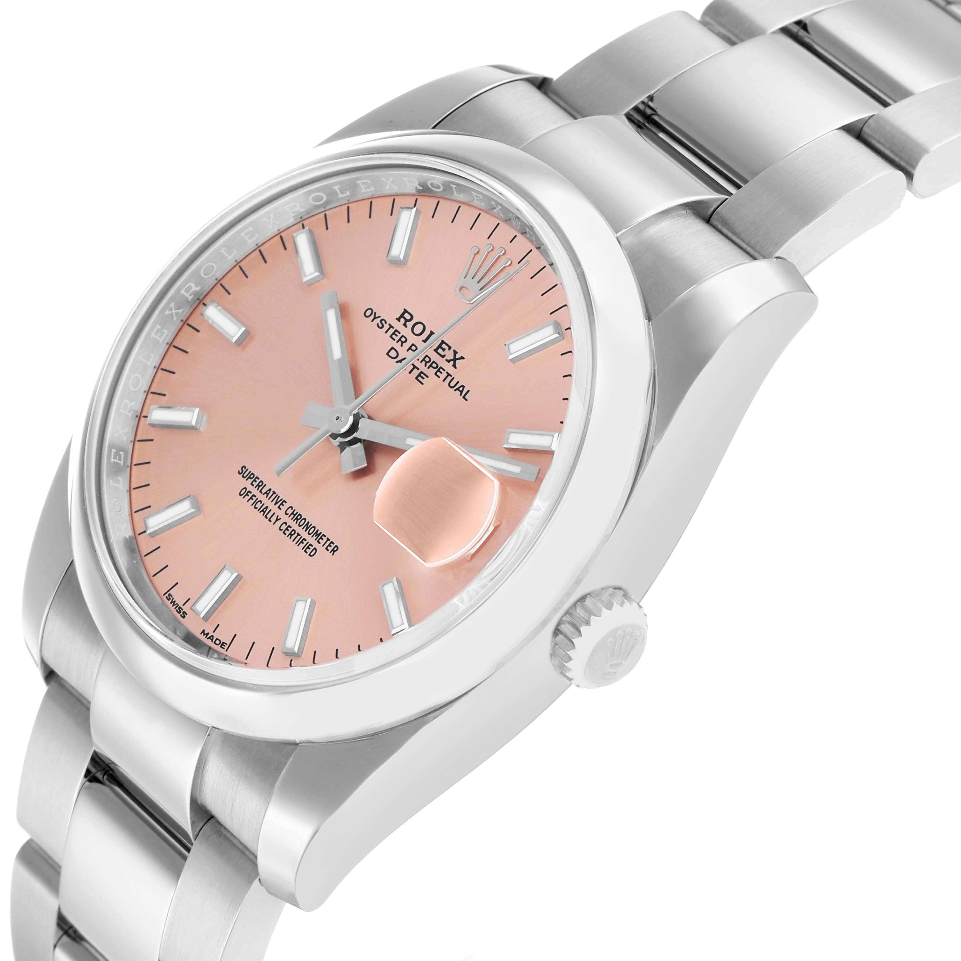 The Rolex Oyster Perpetual 115200 Men
s Stainless Steel Pink Dial watch is shown at an angle displaying the face, bezel, crown, and part of the bracelet.