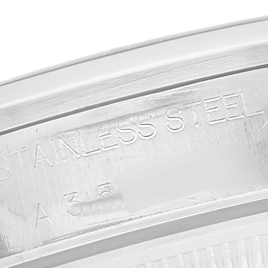 This image shows a close-up view of the inner casing of the Rolex Date 15200 Men's Stainless Steel White Dial 15200 Men's Stainless Steel White Dial model, featuring the 'STAINLESS STEEL' engraving.