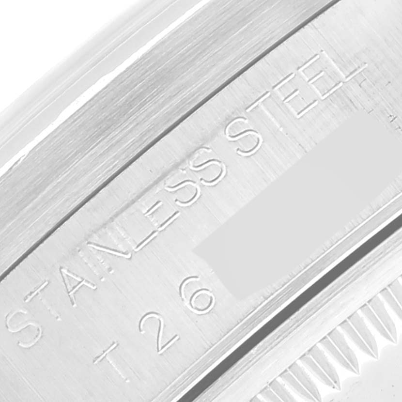This close-up image shows the stainless steel case back of a Rolex Date 15210 Men's Stainless Steel White Dial 15210 Men's Stainless Steel White Dial model watch, focusing on the engraved text.