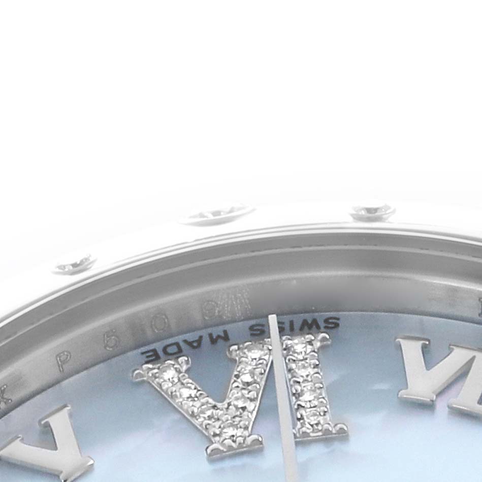 This close-up of the Rolex Mid-Size 178344 Women
s Stainless Steel Mother of Pearl Dial watch shows part of the dial and bezel, focusing on a diamond-set Roman numeral.