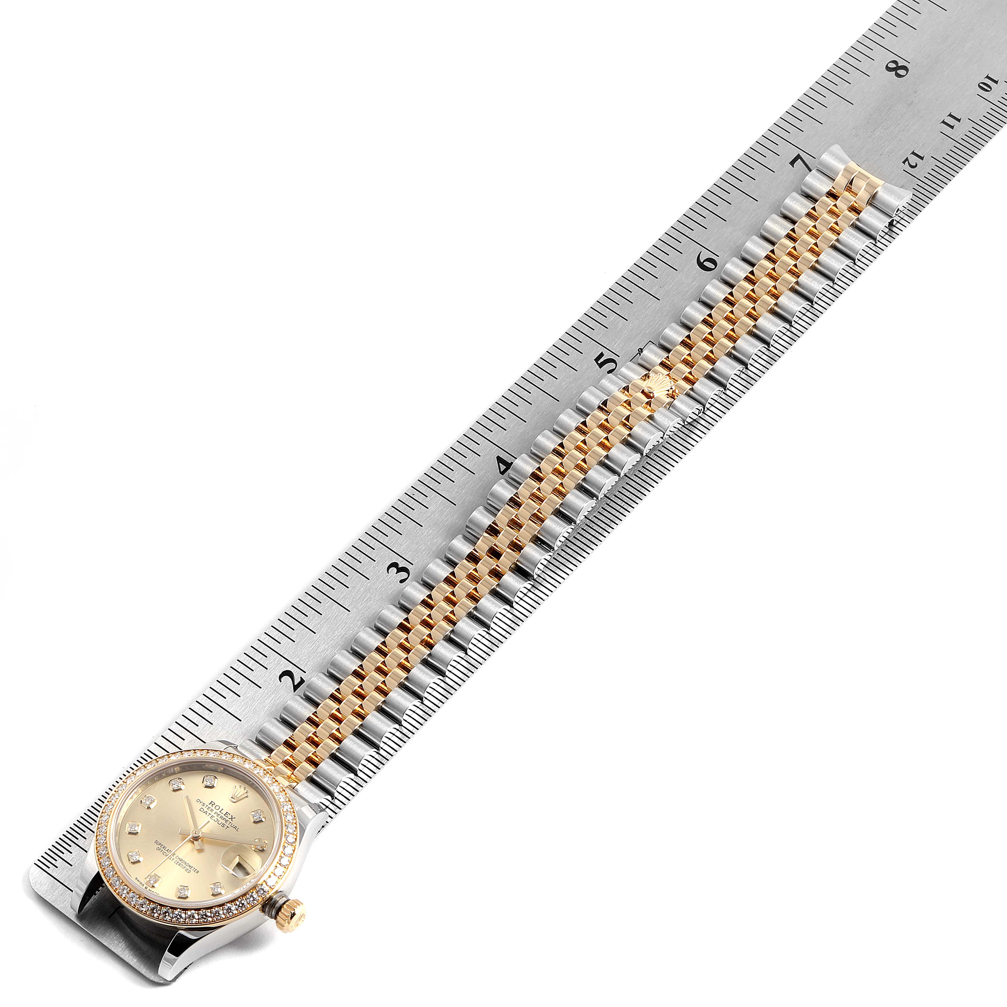 The Rolex Mid-Size 278383 Women
s Steel and Gold (two tone) Champagne Dial 278383 Women
s Steel and Gold (two tone) Champagne Dial model watch is shown from a top-down angle with its face, bezel, and part of the bracelet visible.