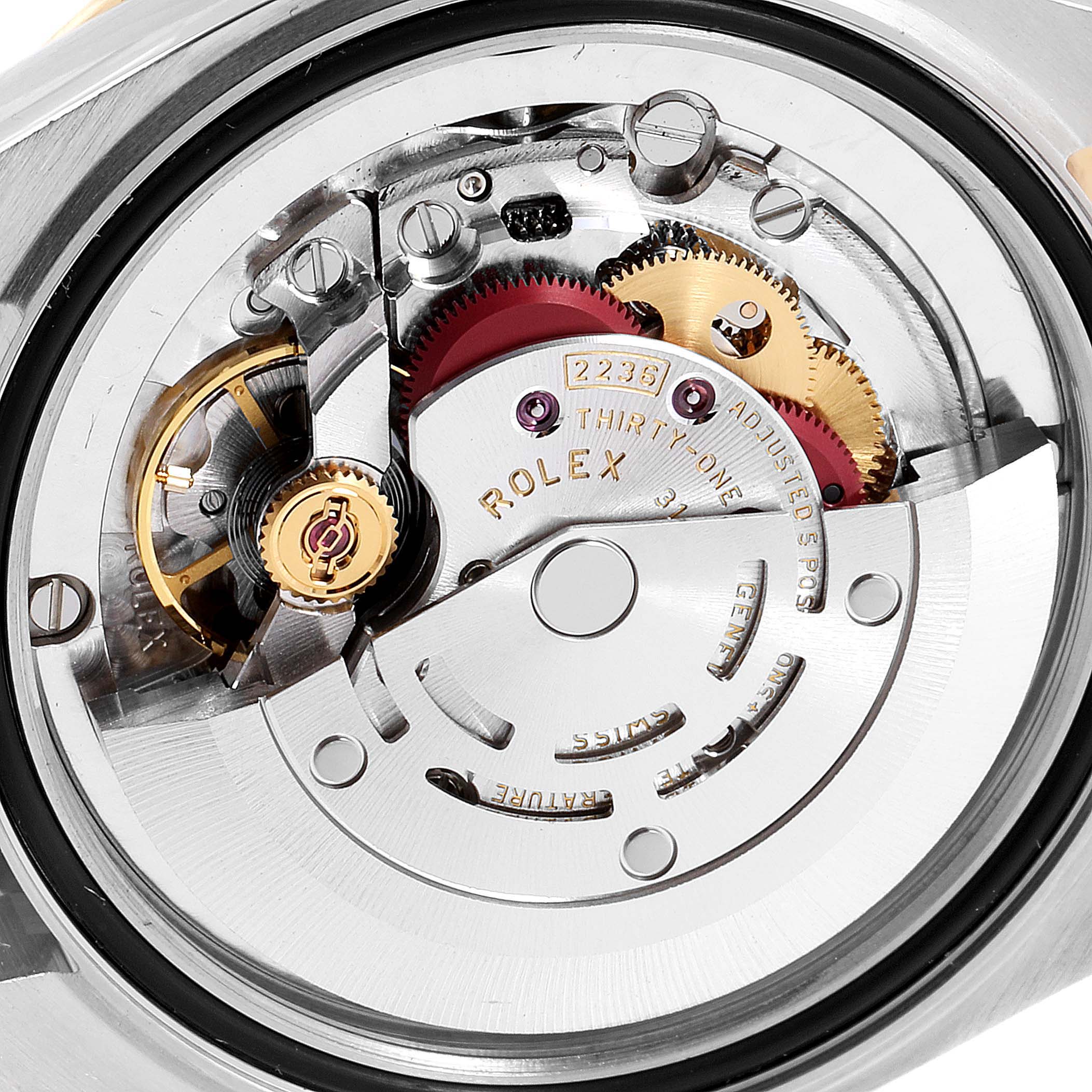The image shows a close-up view of the movement mechanism of a Rolex Mid-Size 278383 Women
s Steel and Gold (two tone) Champagne Dial 278383 Women
s Steel and Gold (two tone) Champagne Dial watch.