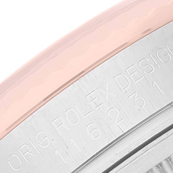 Close-up of the edge and engraved lettering on the casing of a Rolex Datejust 116231 Men's Steel and Gold (two tone) Black Dial 116231 Men's Steel and Gold (two tone) Black Dial watch.