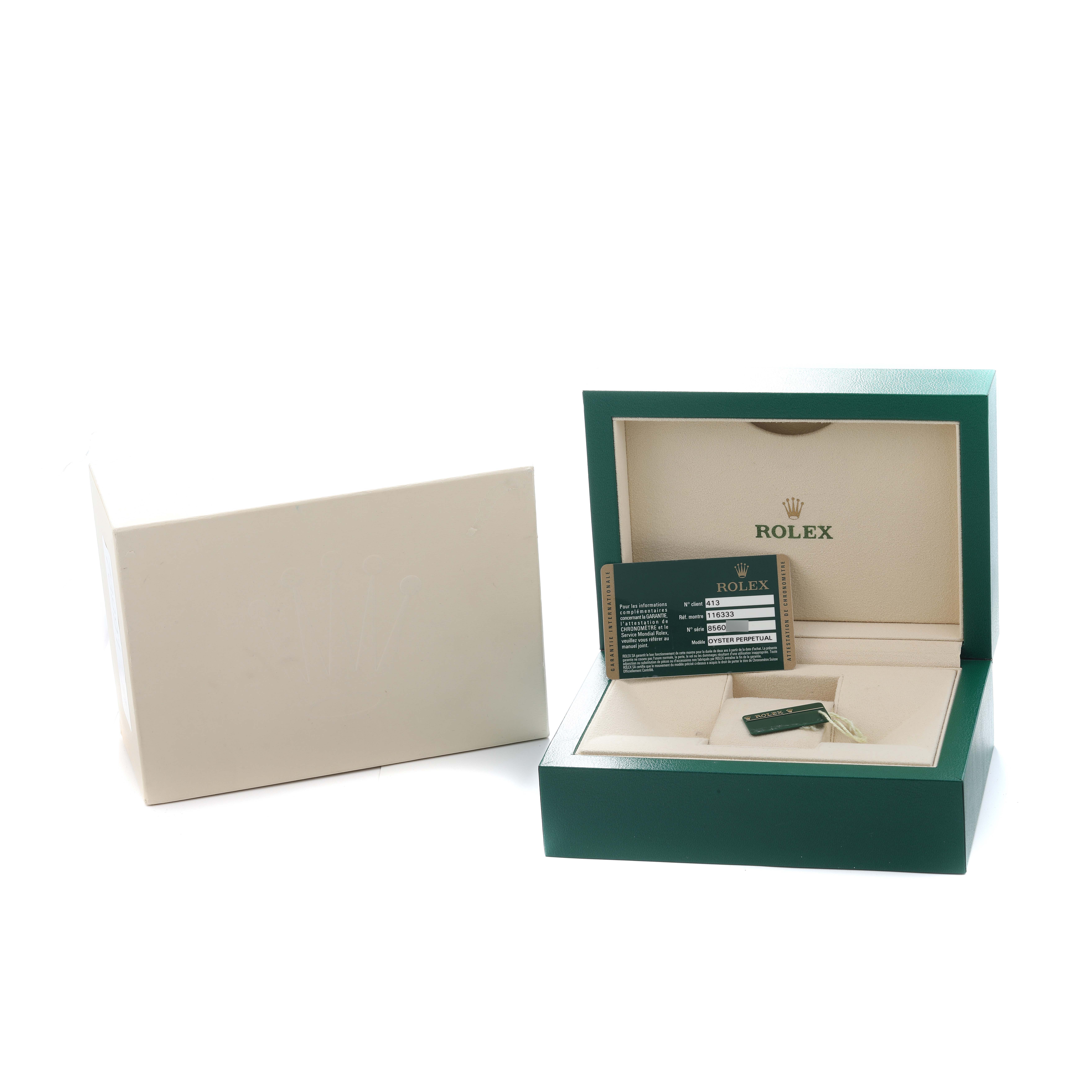 The image shows the open box and warranty card for a Rolex Datejust 41 116333 Men
s Steel and Gold (two tone) Silver Dial.