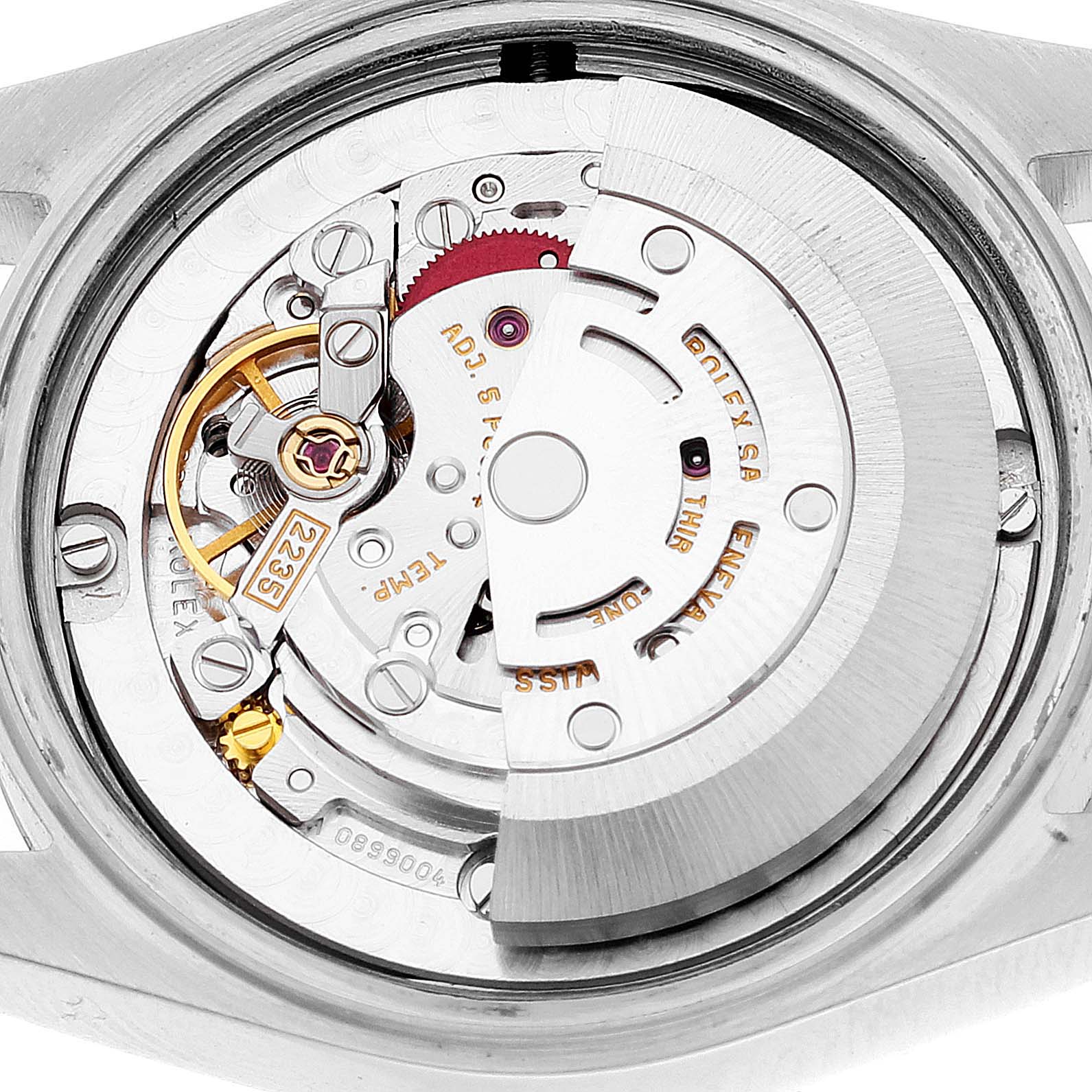 The image shows a close-up of the movement and internal mechanism of a Mid-Size Rolex watch.