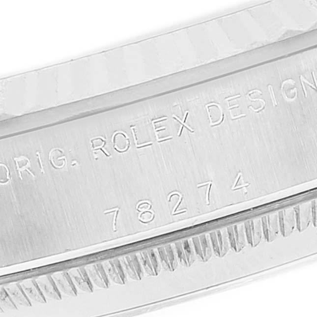 This close-up image shows the engraved bezel and model number of a Mid-Size Rolex watch.
