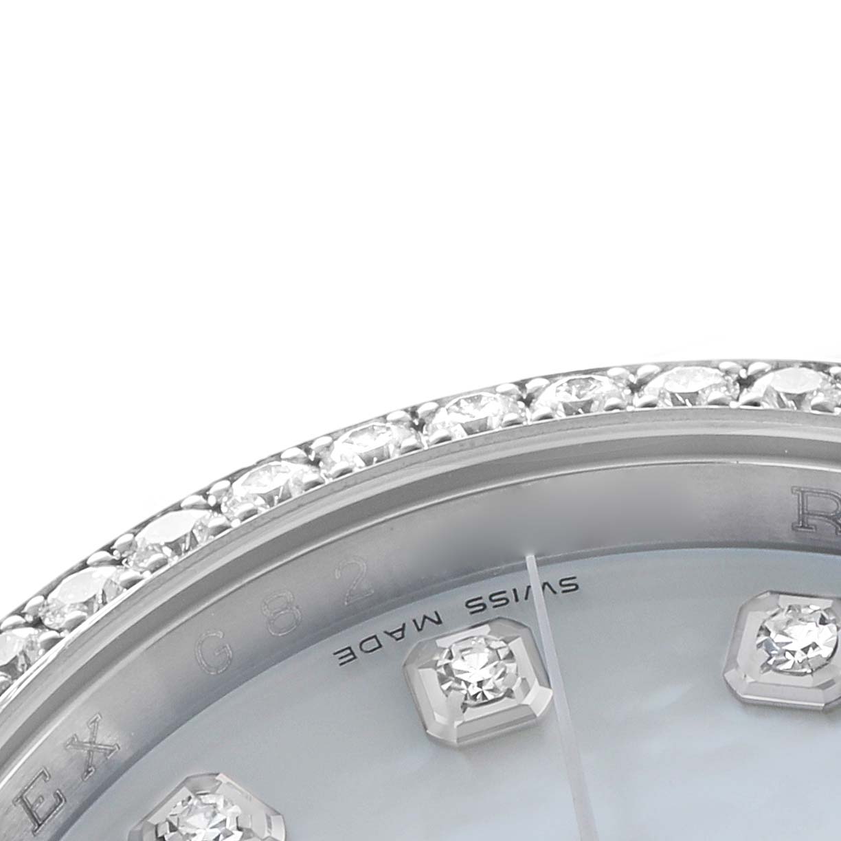 The image shows a close-up of the bezel and part of the dial with diamond hour markers on the Rolex Datejust 116244 Men
s Stainless Steel Mother of Pearl Dial.