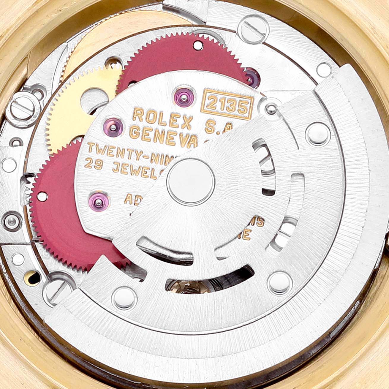 The image shows the intricate inner mechanism of a Rolex President 69178 Women's Yellow Gold Champagne Dial 69178 Women's Yellow Gold Champagne Dial model watch, focusing on its gears and movement parts.