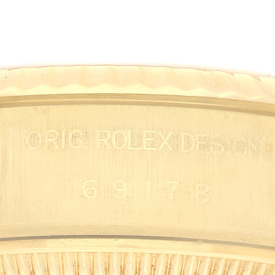 This image shows a close-up of the inner watch casing with the engraved design number of a Rolex President 69178 Women's Yellow Gold Champagne Dial 69178 Women's Yellow Gold Champagne Dial model.