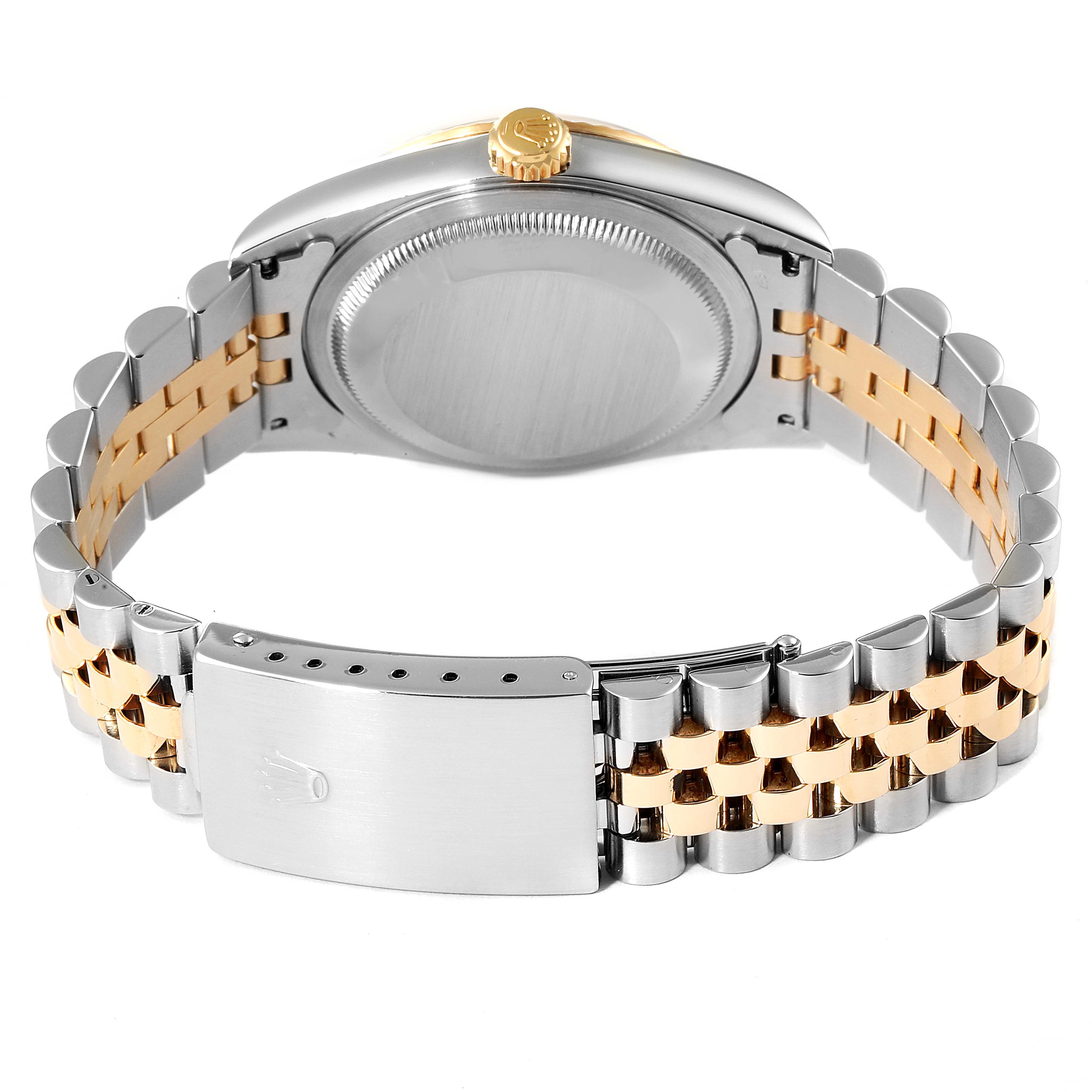 This image shows the back case and bracelet of the Rolex Datejust 16233 Men's Steel and Gold (two tone) Black Dial 16233 Men's Steel and Gold (two tone) Black Dial watch with a two-tone (silver and gold) finish.