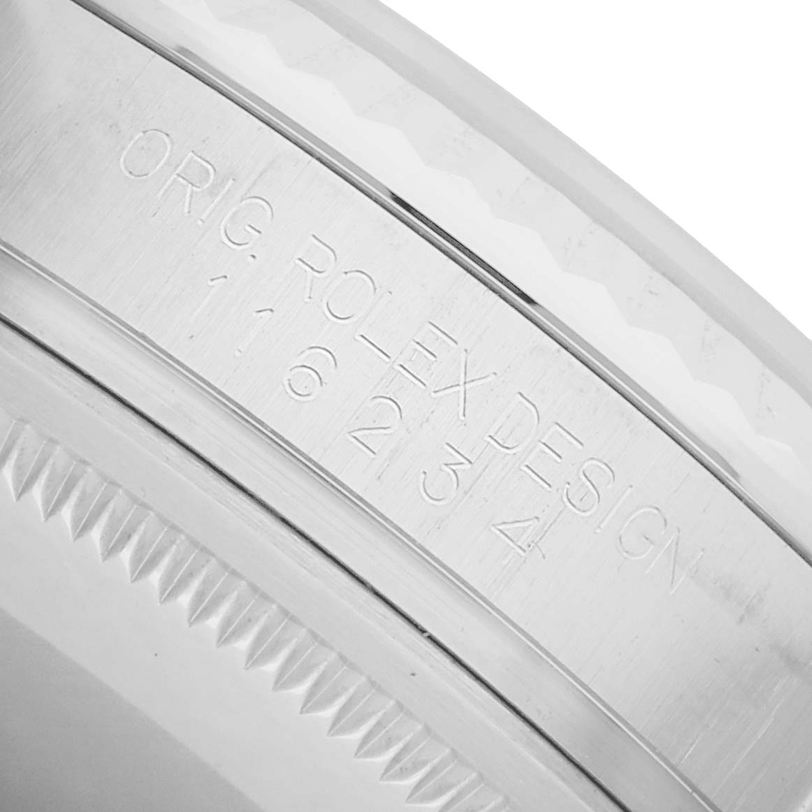 The image shows a close-up of the side engraving on a Rolex Datejust 116234 Men
s Stainless Steel Silver Dial, highlighting the watch
s model details.