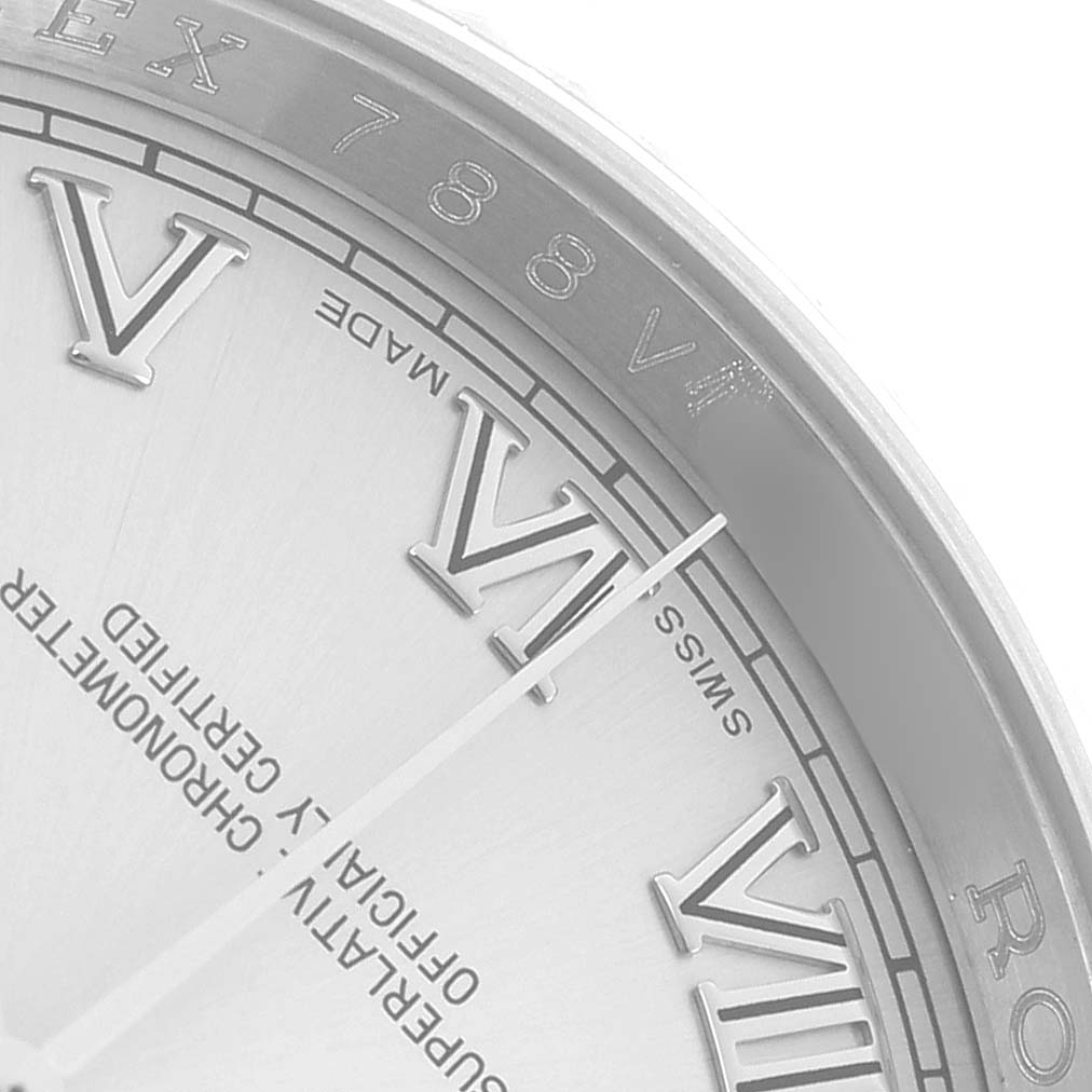 The image shows a close-up of the dial edge and Roman numerals on a Rolex Datejust 116234 Men
s Stainless Steel Silver Dial, highlighting the VI and VII markers.