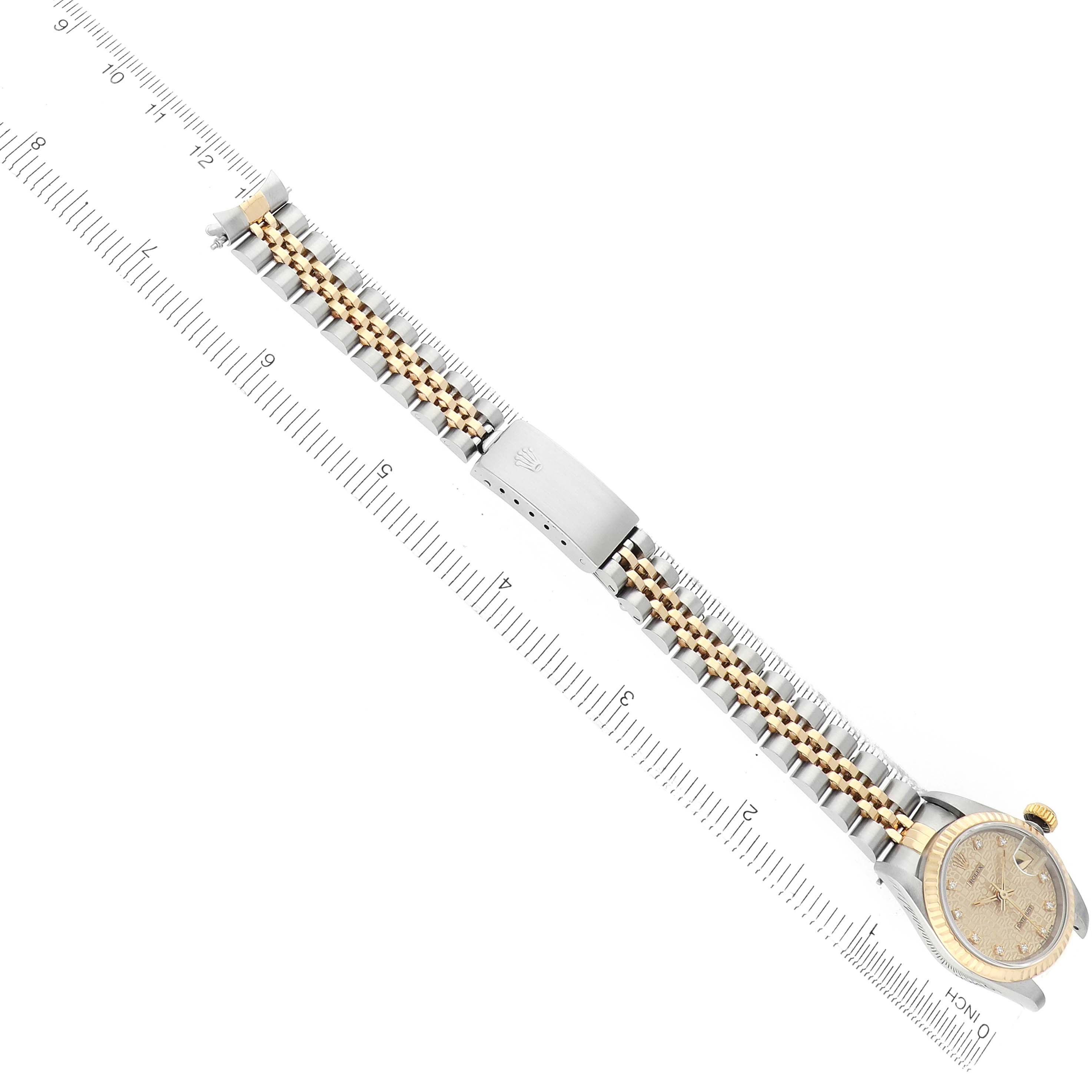 The Rolex Datejust 69173 Women
s Steel and Gold (two tone) Champagne Dial watch is shown from a top-down angle, highlighting the bracelet and clasp.