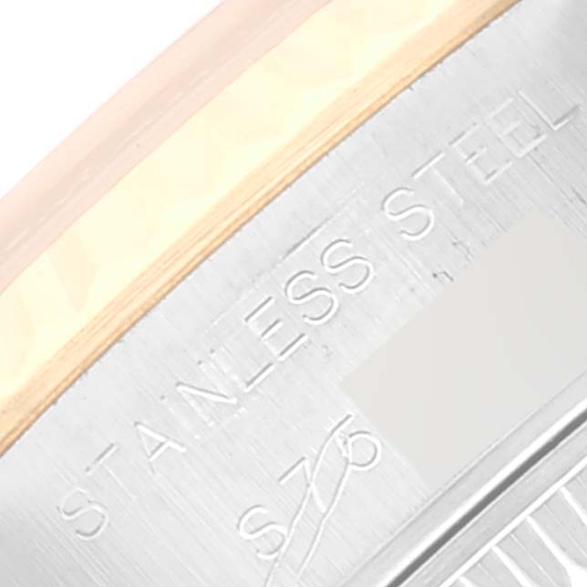 This image shows an angled close-up of the side of a Rolex Datejust 69173 Women's Steel and Gold (two tone) Blue Dial 69173 Women's Steel and Gold (two tone) Blue Dial watch, focusing on the stainless steel engraving.