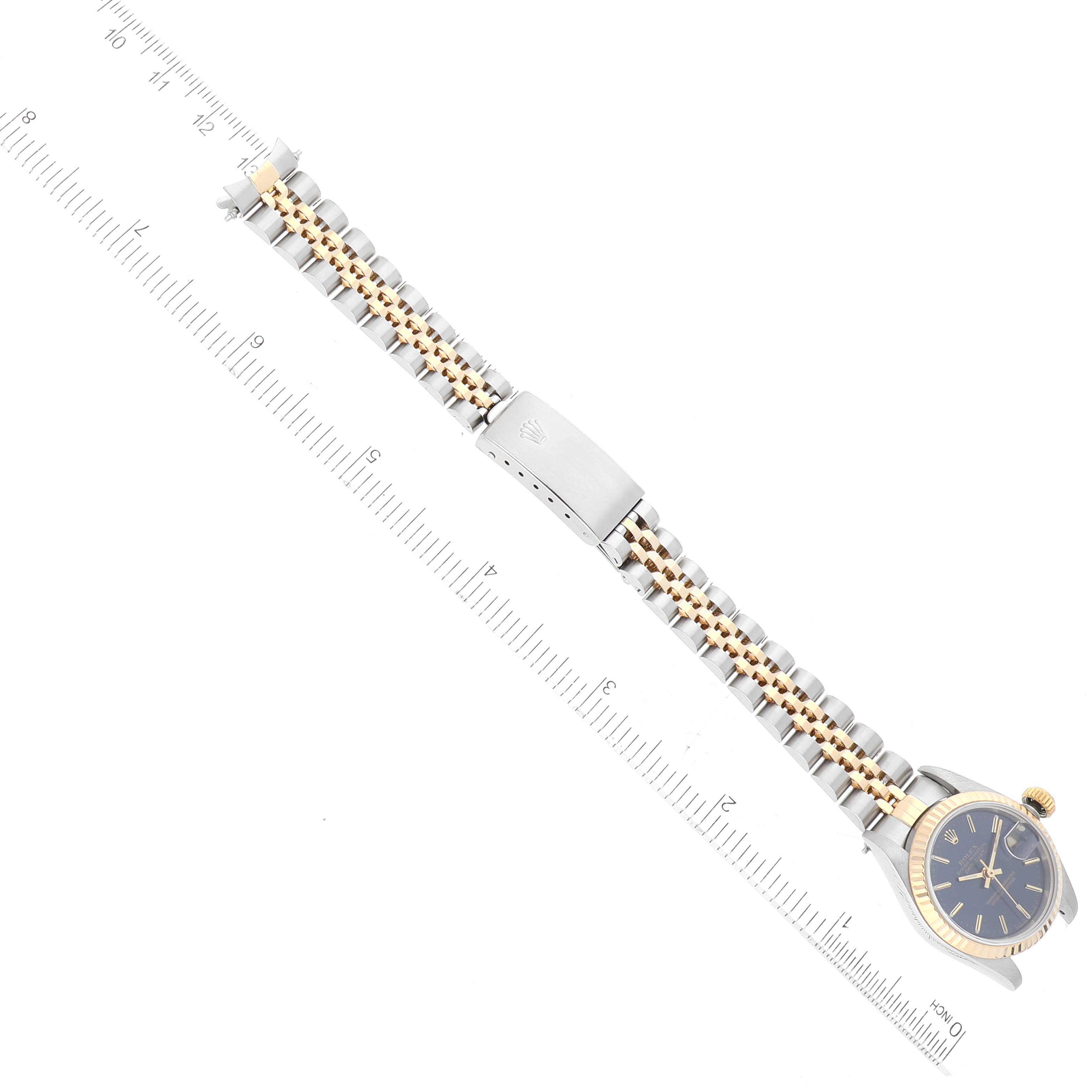 The image shows a top-down view of a Rolex Datejust 69173 Women's Steel and Gold (two tone) Blue Dial 69173 Women's Steel and Gold (two tone) Blue Dial watch featuring its face, bezel, and bracelet.