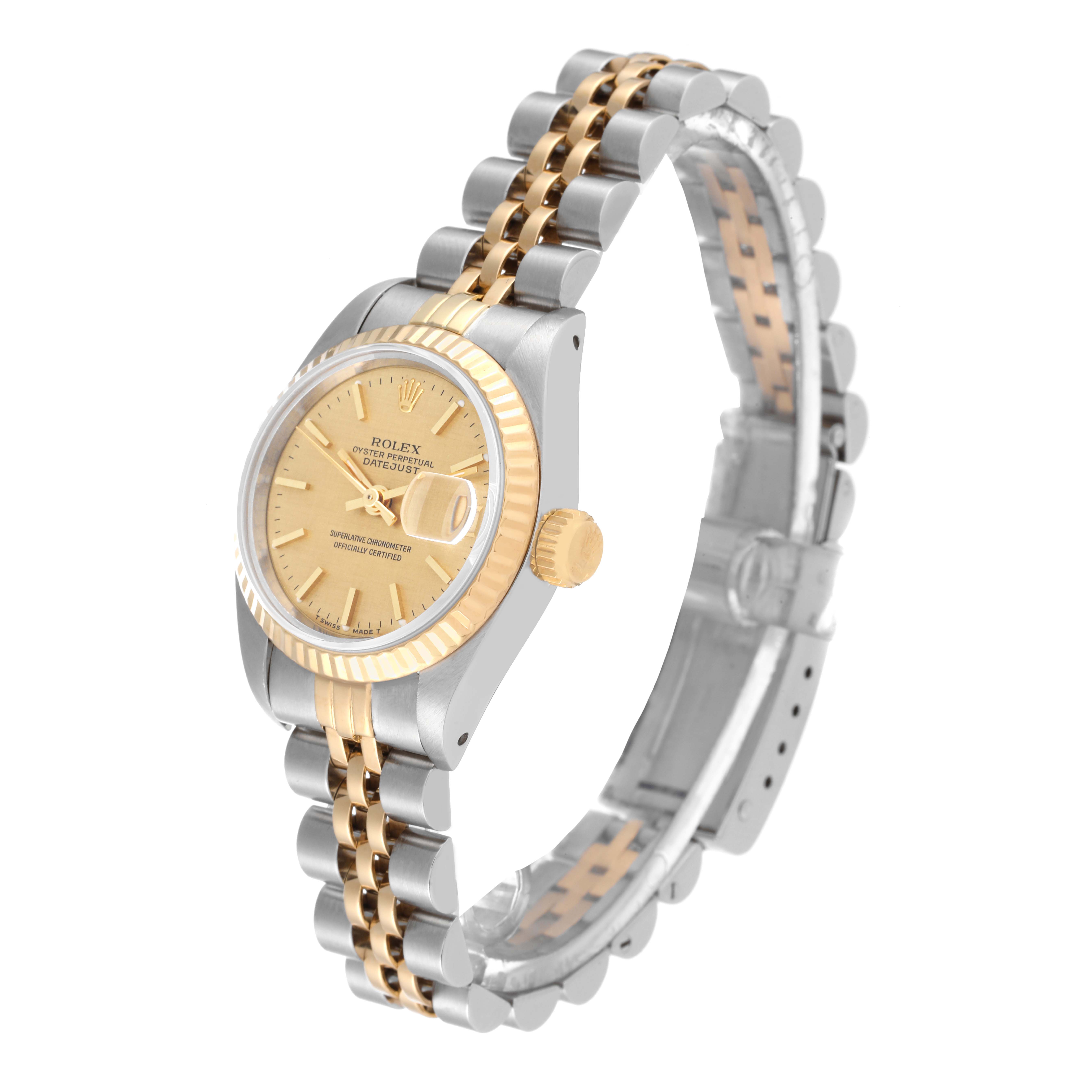 This image shows a Rolex Datejust 69173 Women
s Steel and Gold (two tone) Champagne Dial 69173 Women
s Steel and Gold (two tone) Champagne Dial watch at a three-quarter angle, highlighting the gold and silver bracelet and face with a Cyclops lens.