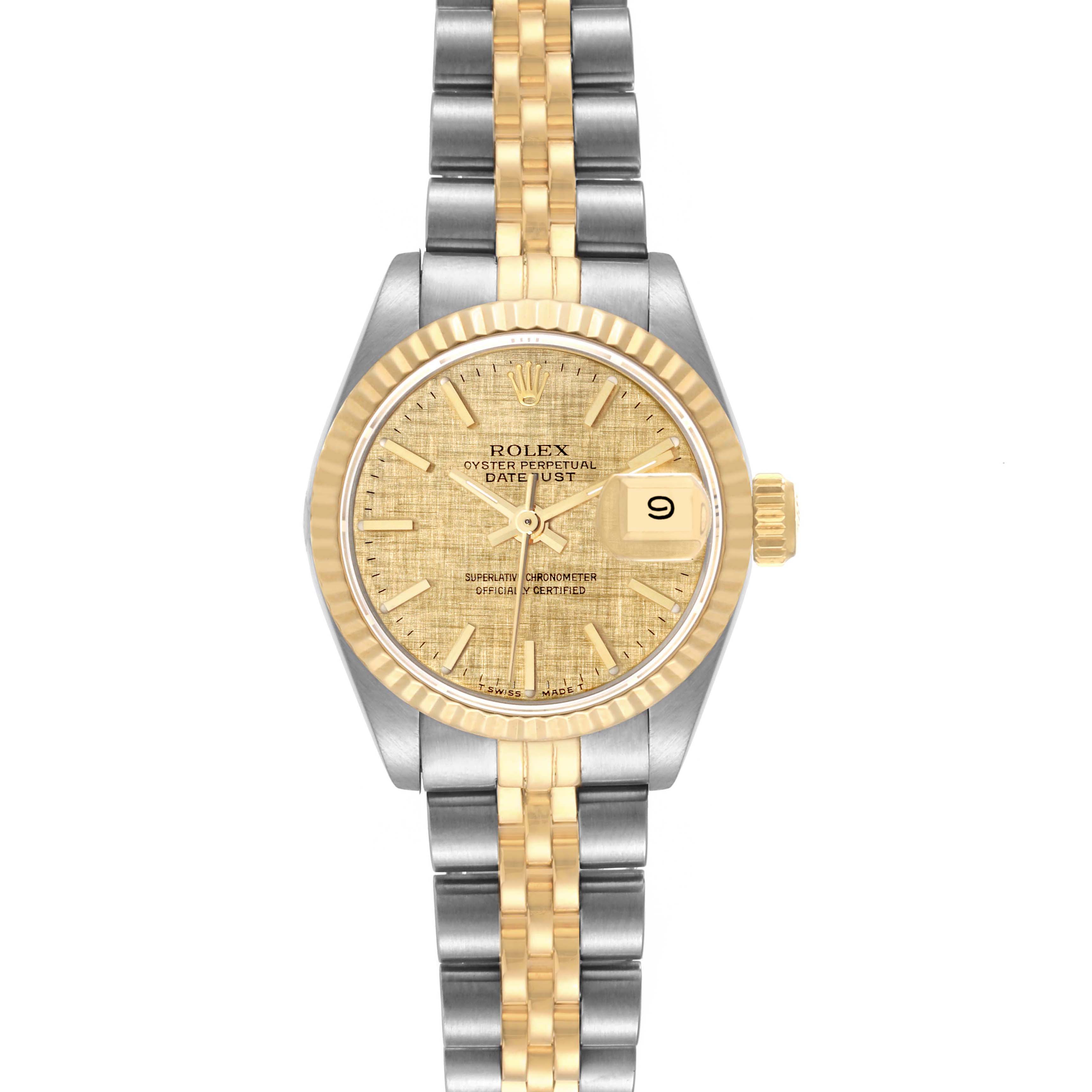 The image shows a Rolex Datejust 69173 Women
s Steel and Gold (two tone) Champagne Dial 69173 Women
s Steel and Gold (two tone) Champagne Dial watch from a top-down angle, displaying its dial, fluted bezel, crown, and two-tone bracelet.