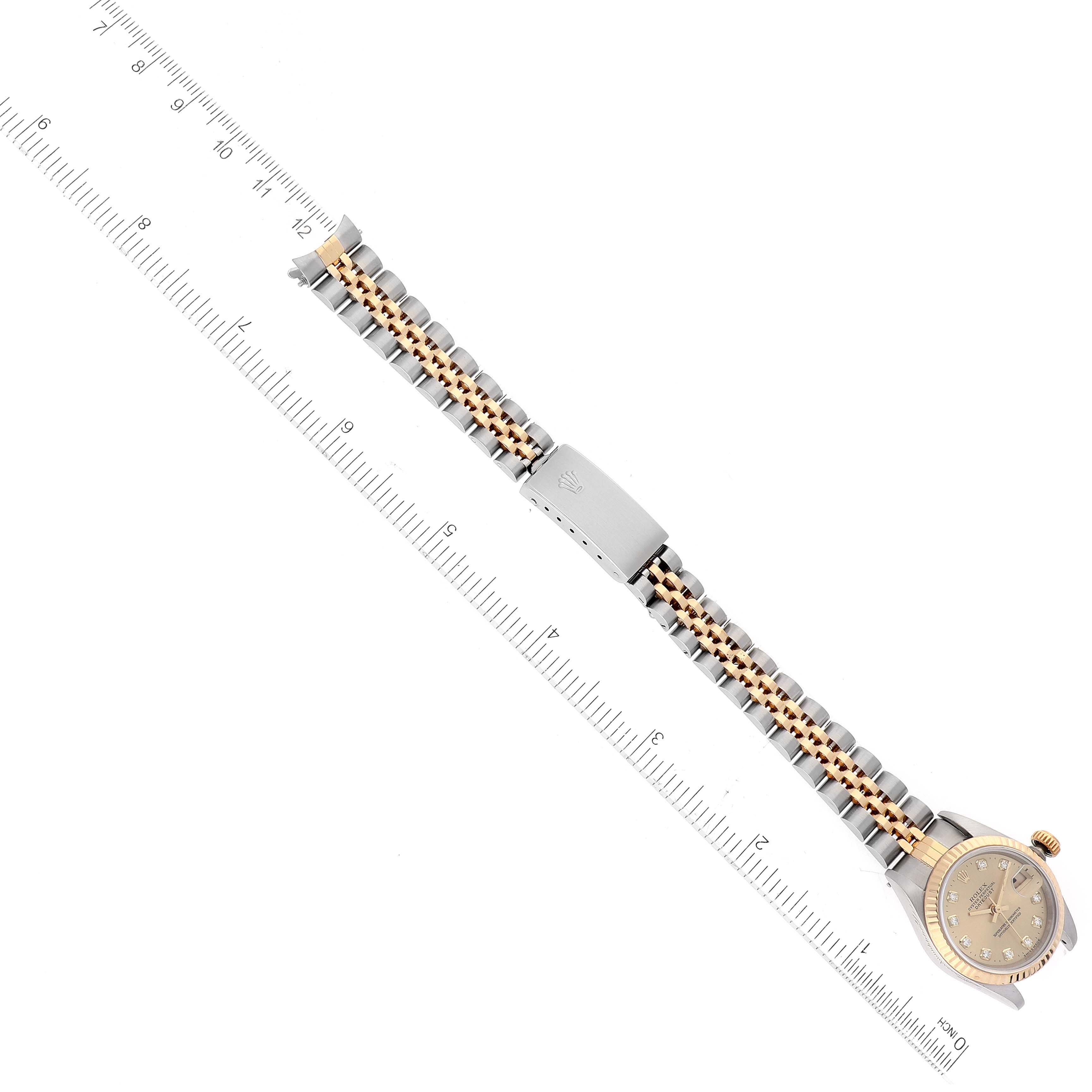 The image shows a Rolex Datejust 69173 Women's Steel and Gold (two tone) Champagne Dial 69173 Women's Steel and Gold (two tone) Champagne Dial watch laid flat with emphasis on the bracelet and clasp, positioned against a ruler for scale.