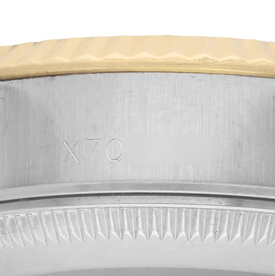 The image shows a close-up of a Rolex Datejust 69173 Women
s Steel and Gold (two tone) Black Dial watch
s case side and bezel edge, highlighting the engraved model number.