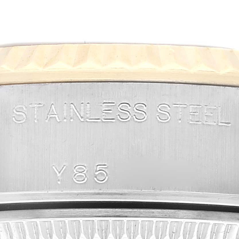 The image shows a close-up of the side of a stainless steel Rolex Datejust 79173 Women's Steel and Gold (two tone) Champagne Dial 79173 Women's Steel and Gold (two tone) Champagne Dial watch case with model engraving.