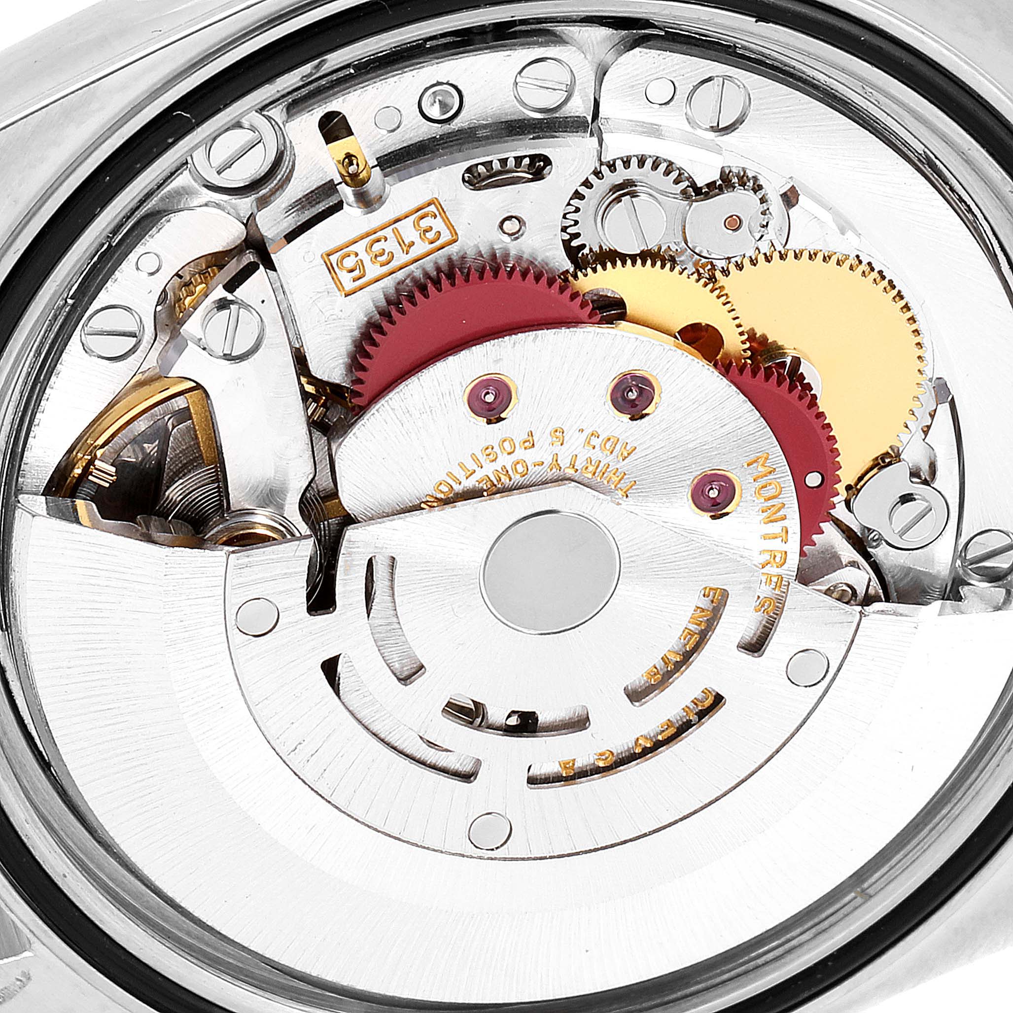 This image shows a close-up of the internal mechanism of a Rolex Datejust 16233 Men's Steel and Gold (two tone) White Dial 16233 Men's Steel and Gold (two tone) White Dial watch, focusing on the movement and gears.