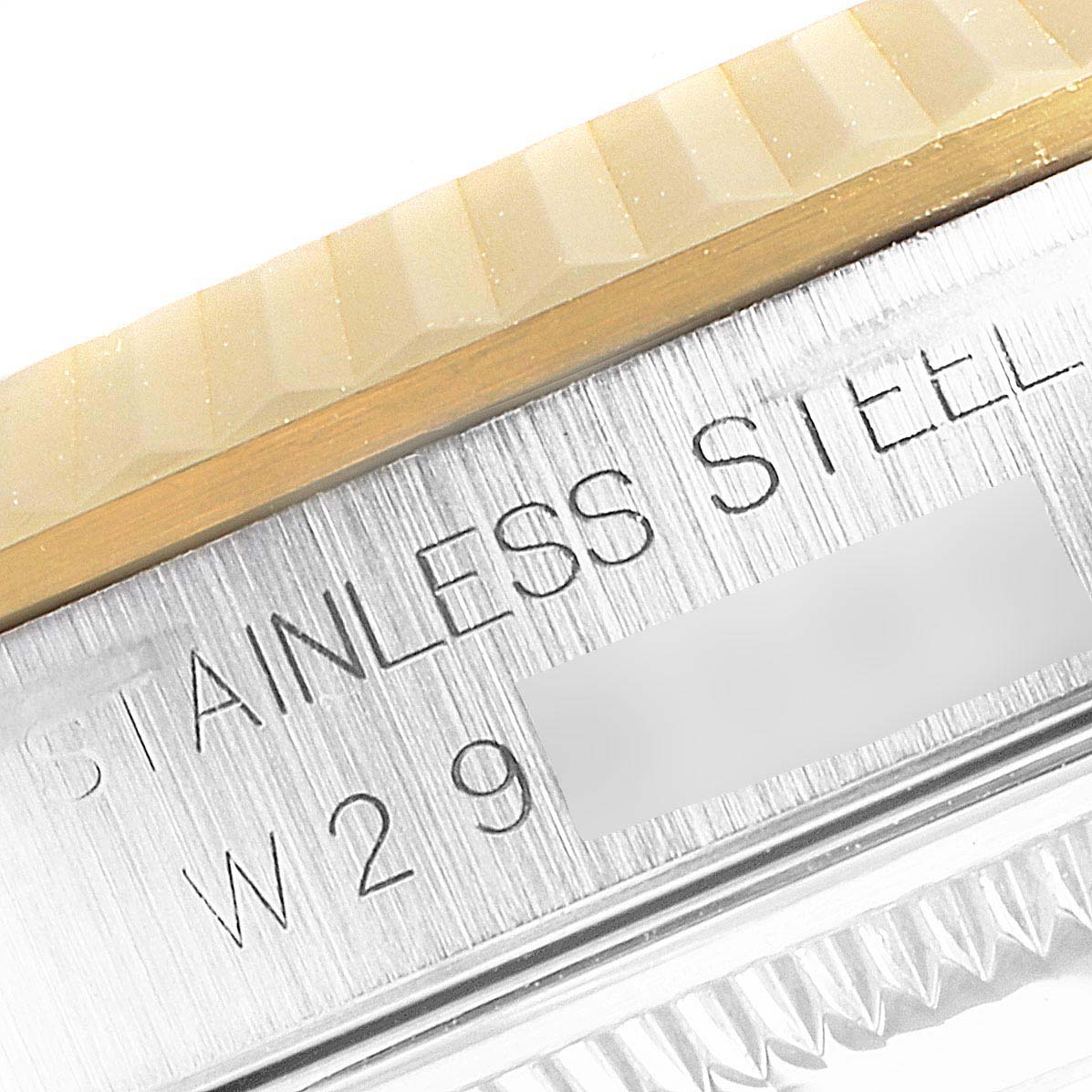 This image shows a close-up of the Rolex Datejust 16233 Men's Steel and Gold (two tone) White Dial 16233 Men's Steel and Gold (two tone) White Dial watch case side, highlighting the stainless steel and the model number engraving.