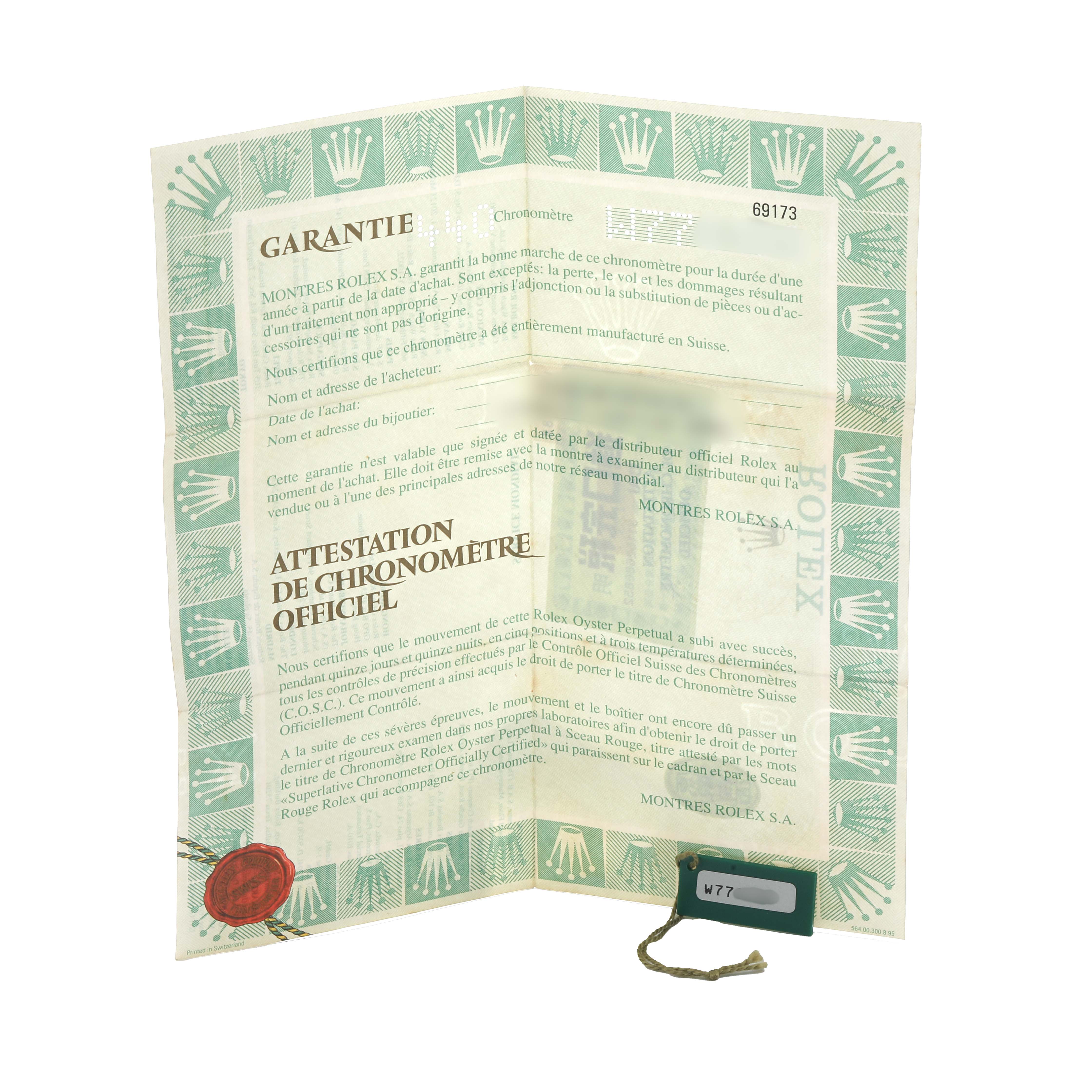 The image shows a Rolex Datejust 69173 Women
s Steel and Gold (two tone) White Dial warranty card and chronometer certification, displayed partially open.