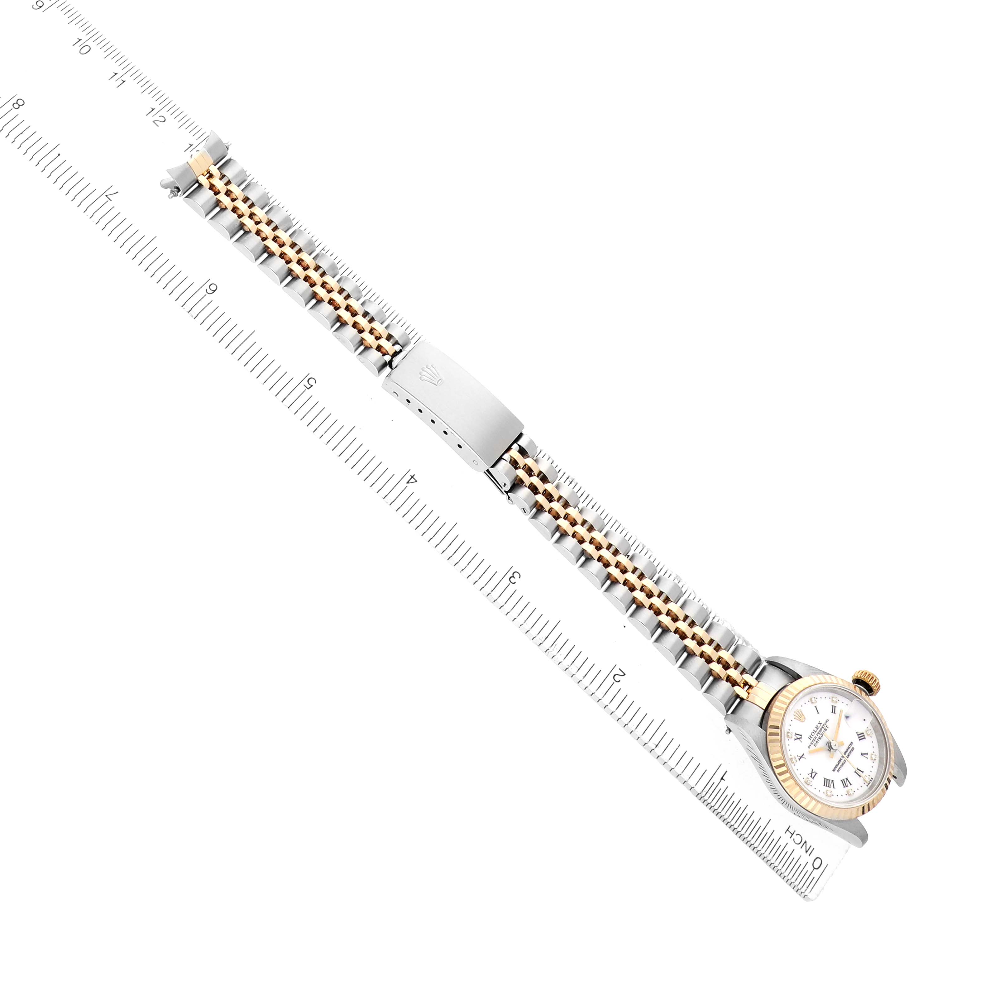 The Rolex Datejust 69173 Women
s Steel and Gold (two tone) White Dial watch is shown at a side angle, highlighting the dial, bezel, and metal bracelet with a clasp.