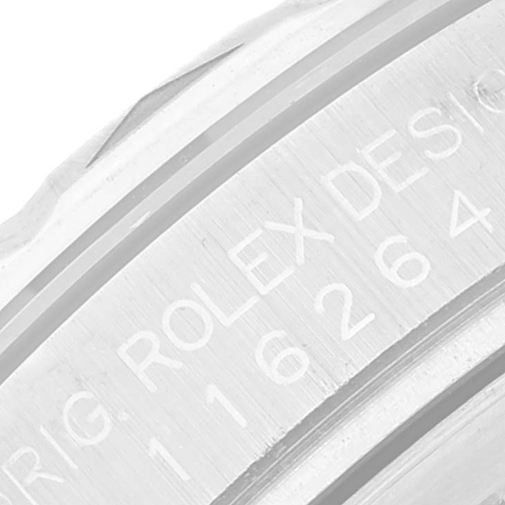 The image shows a close-up of the side engraving on a Rolex Turn-o-Graph 116264 Men's Stainless Steel Blue Dial 116264 Men's Stainless Steel Blue Dial watch.