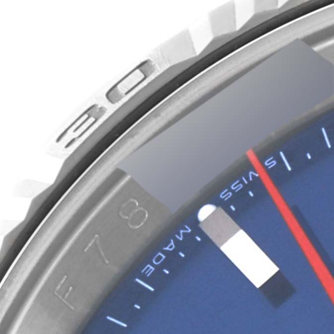 The image shows a close-up angle of the Rolex Turn-o-Graph 116264 Men's Stainless Steel Blue Dial 116264 Men's Stainless Steel Blue Dial watch bezel and part of the dial.