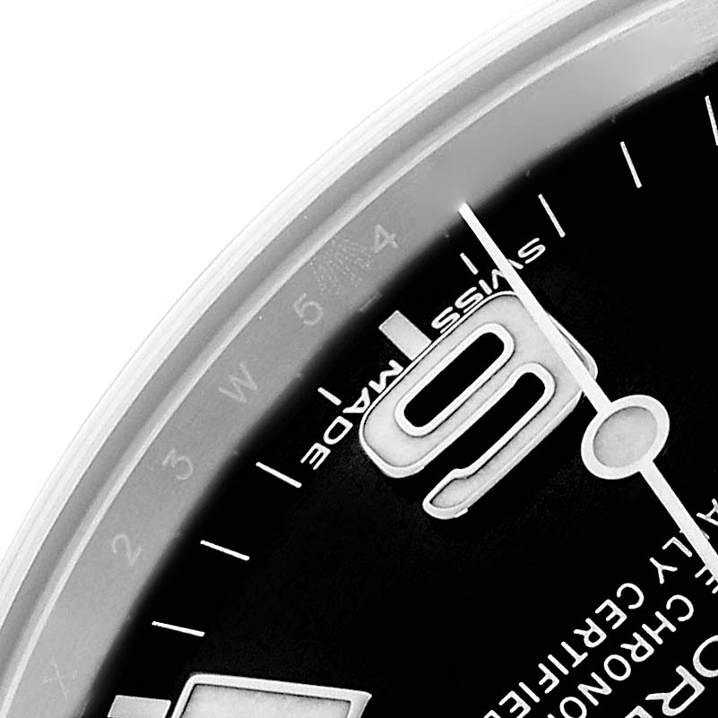 The image shows a close-up of the dial and bezel edge of a Rolex Explorer 214270 Men
s Stainless Steel Black Dial, highlighting the "6" and "Swiss Made" text.