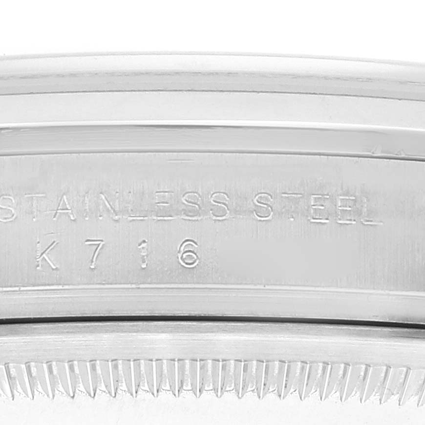 The image shows a close-up of the side of a Rolex Explorer 114270 Men's Stainless Steel Black Dial 114270 Men's Stainless Steel Black Dial watch case, highlighting the stainless steel marking and part of the bezel.