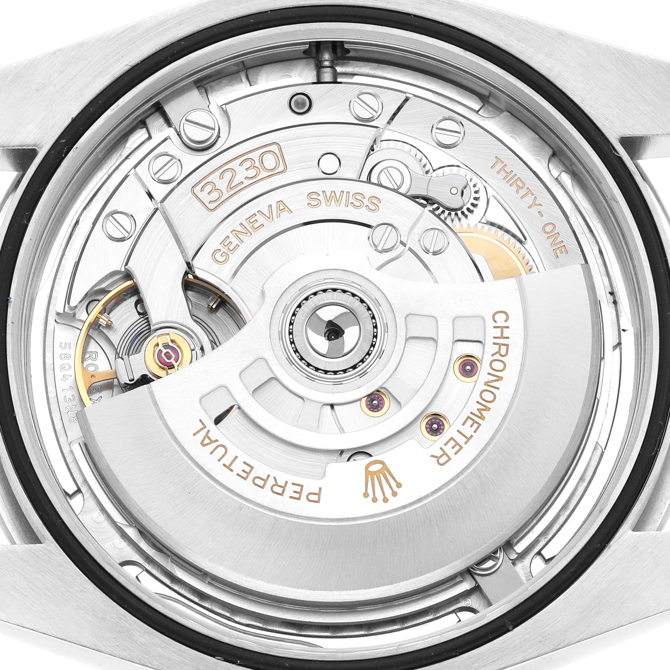 The image shows the movement of a Rolex Oyster Perpetual 124300 Men
s Stainless Steel Silver Dial from the back, highlighting its intricate mechanical components.