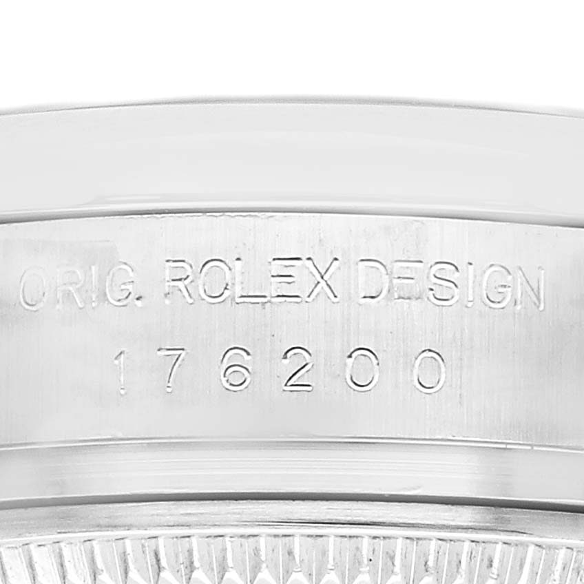 The image shows the side engraving of the Rolex Oyster Perpetual 176200 Women
s Stainless Steel Silver Dial, highlighting the design number.