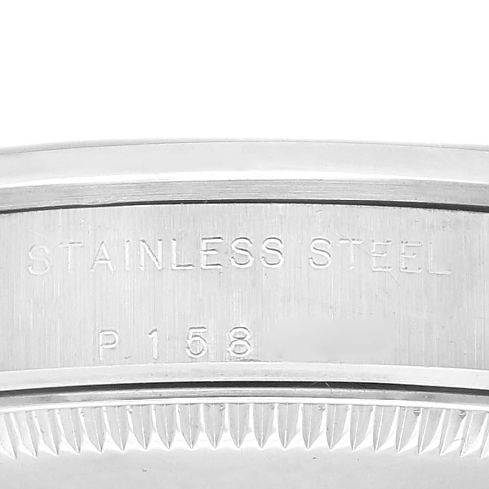 The image shows a close-up of the stainless steel case edge with engravings of a Rolex Oyster Perpetual 77080 Women's Stainless Steel Brown Dial 77080 Women's Stainless Steel Brown Dial watch.