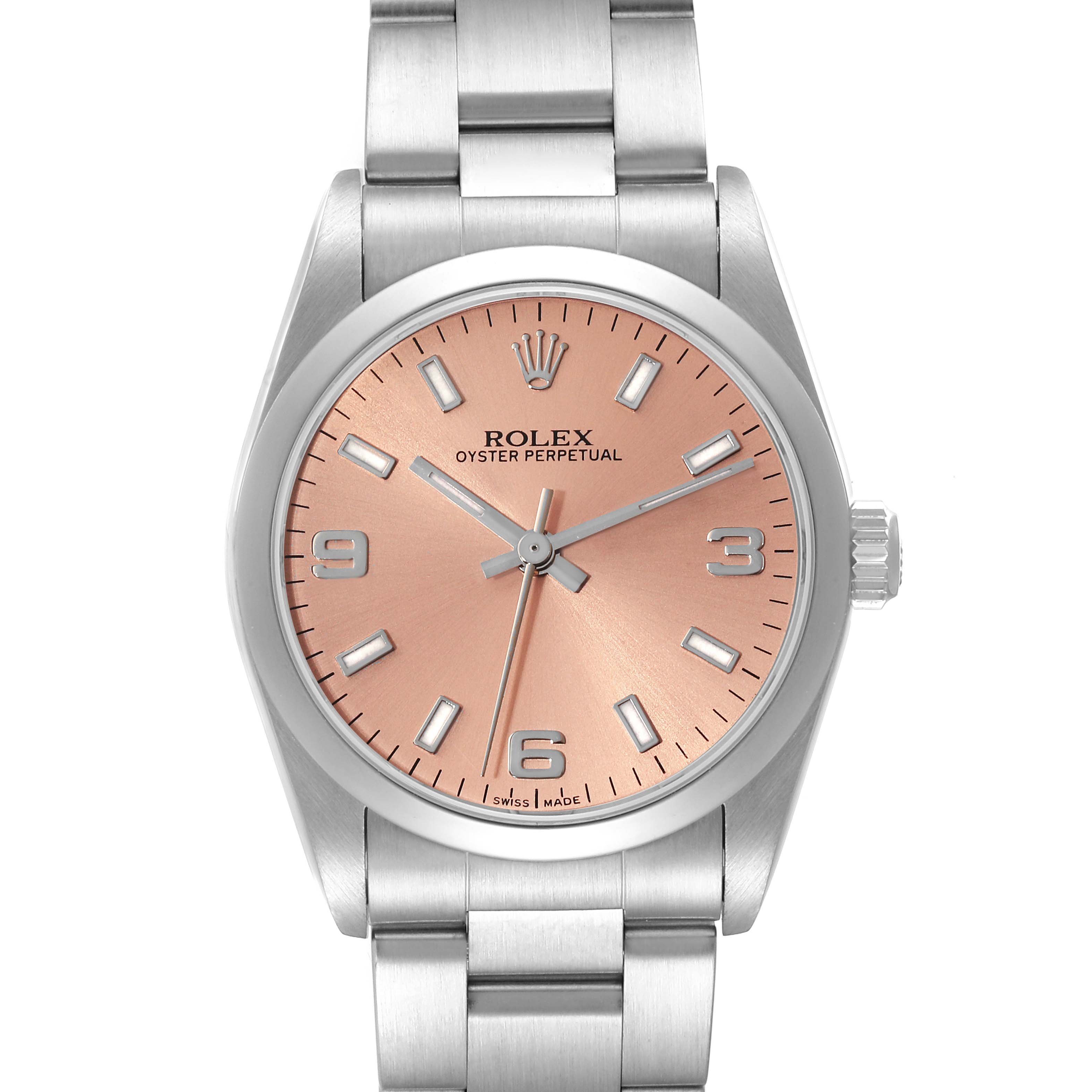 The image shows a front view of a Rolex Oyster Perpetual 77080 Women's Stainless Steel Brown Dial 77080 Women's Stainless Steel Brown Dial watch featuring a salmon-colored dial and a stainless steel bracelet.