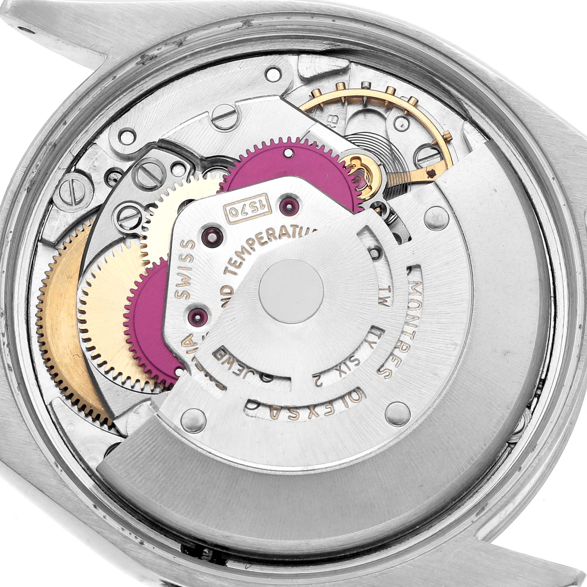 The image shows the internal movement mechanism of a Rolex Oyster Perpetual 1002 Men
s Stainless Steel White Dial watch, viewed from the back.