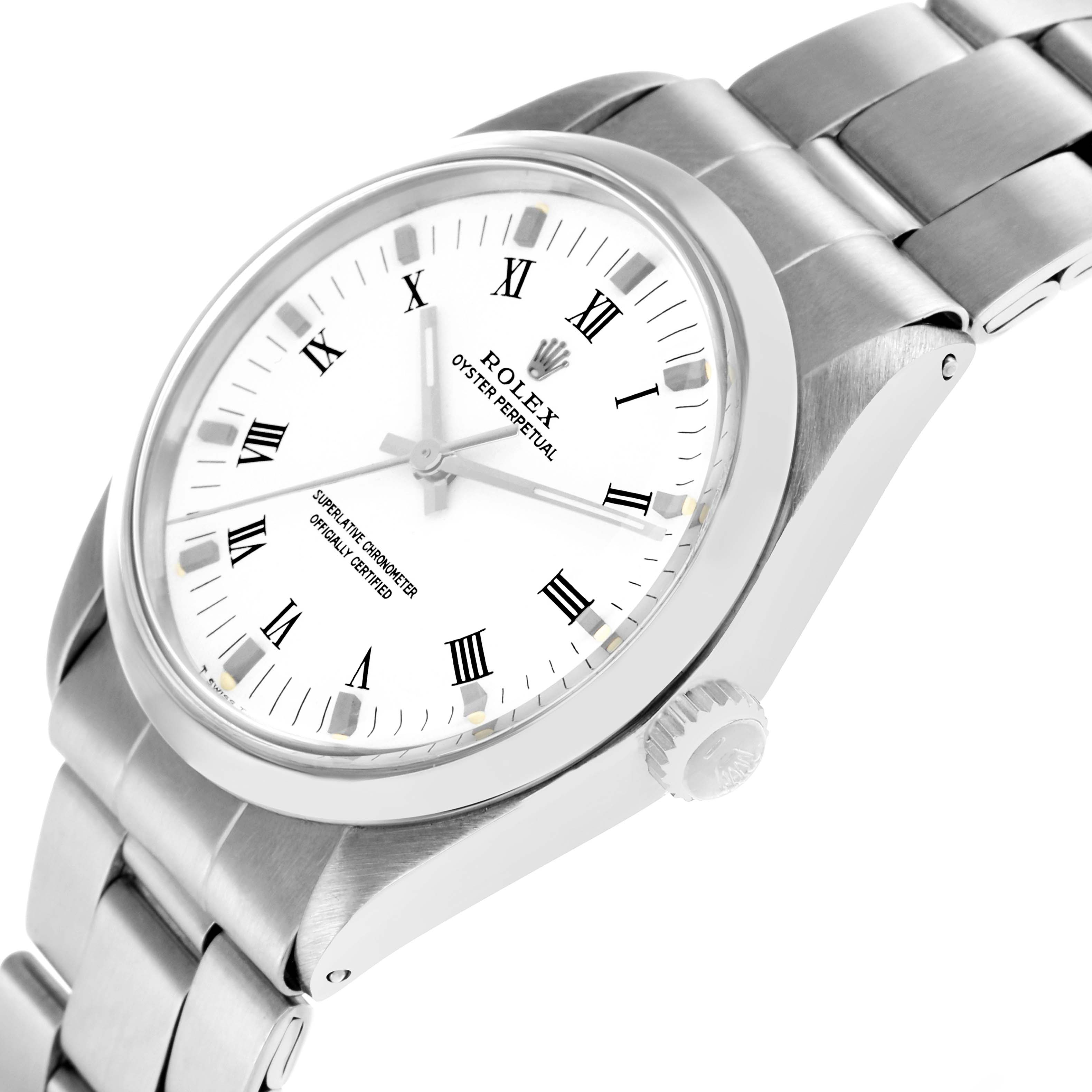 The Rolex Oyster Perpetual 1002 Men
s Stainless Steel White Dial watch is shown at a tilted angle, displaying the dial, crown, and bracelet links.