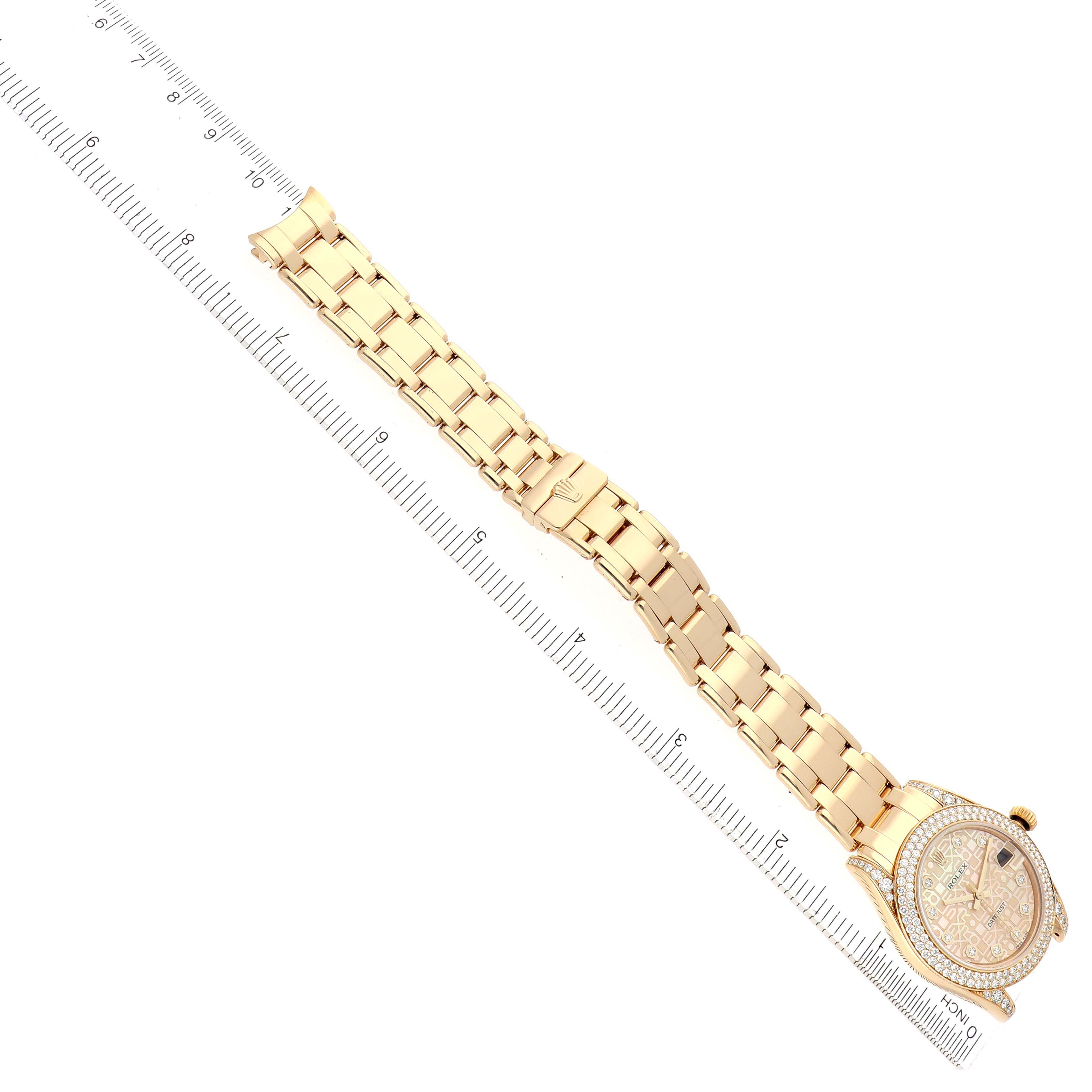 The Rolex Pearlmaster 81358 Women
s Yellow Gold Mother of Pearl Dial watch is shown from a top view, displaying the full bracelet and diamond-studded bezel.