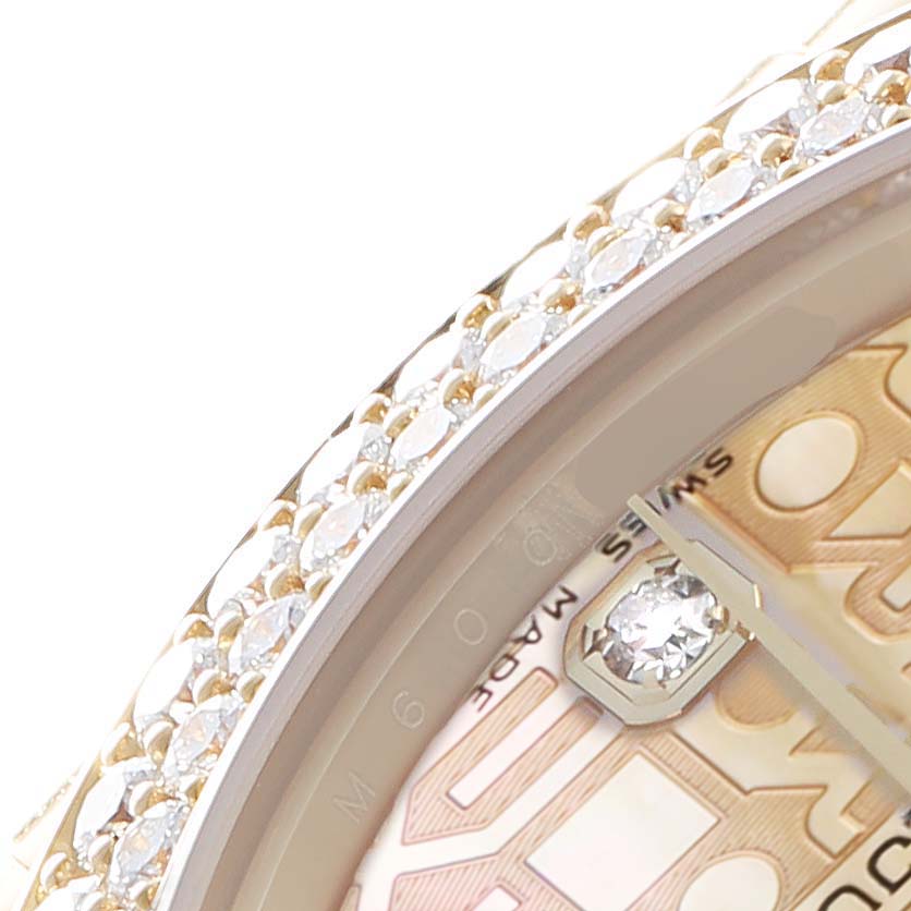 The image shows a close-up of the Rolex Pearlmaster 81358 Women
s Yellow Gold Mother of Pearl Dial watch, focusing on its diamond-encrusted bezel and part of the dial.