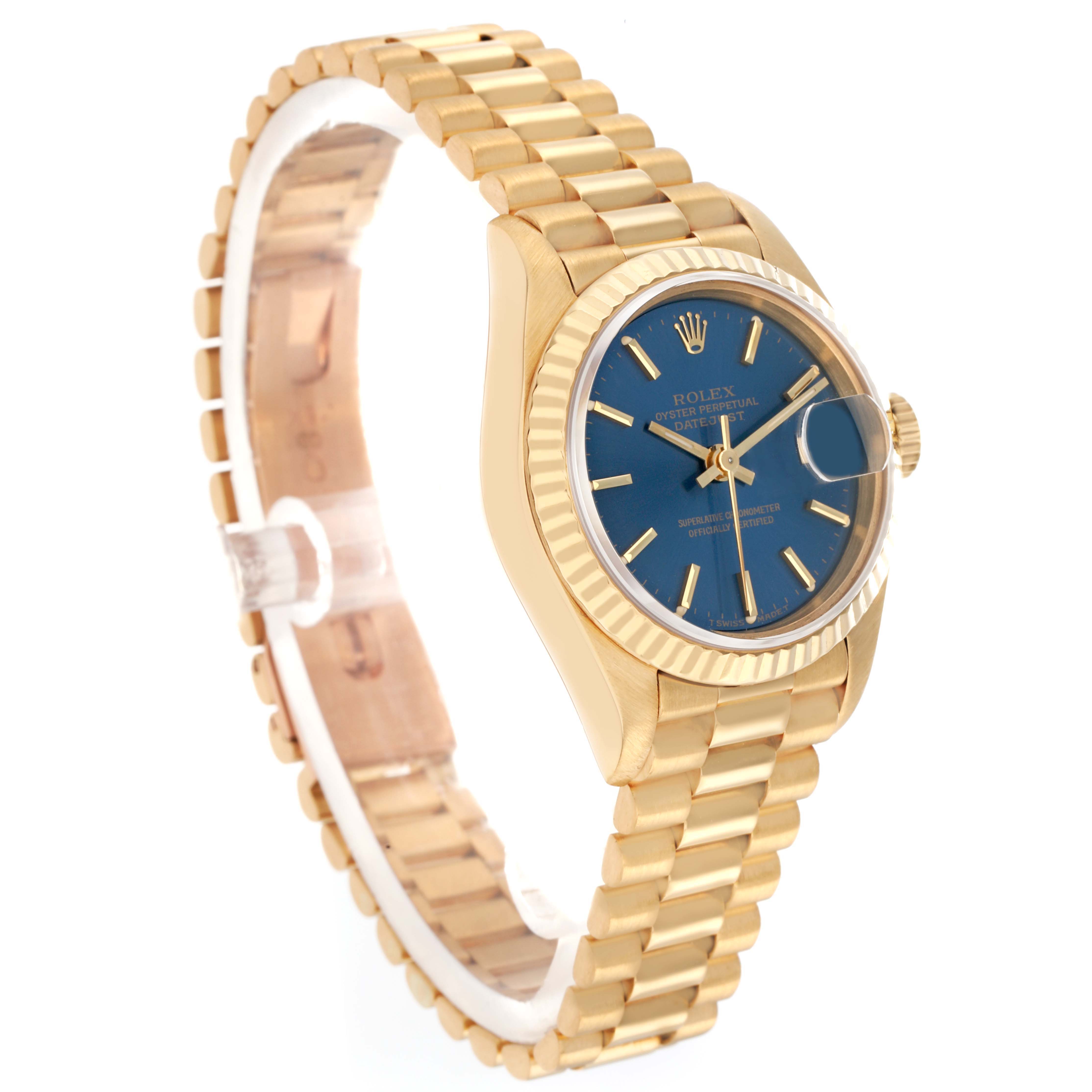 The Rolex President 69178 Women
s Yellow Gold Blue Dial watch is shown at a three-quarter angle, displaying the blue dial, fluted bezel, case, and bracelet.