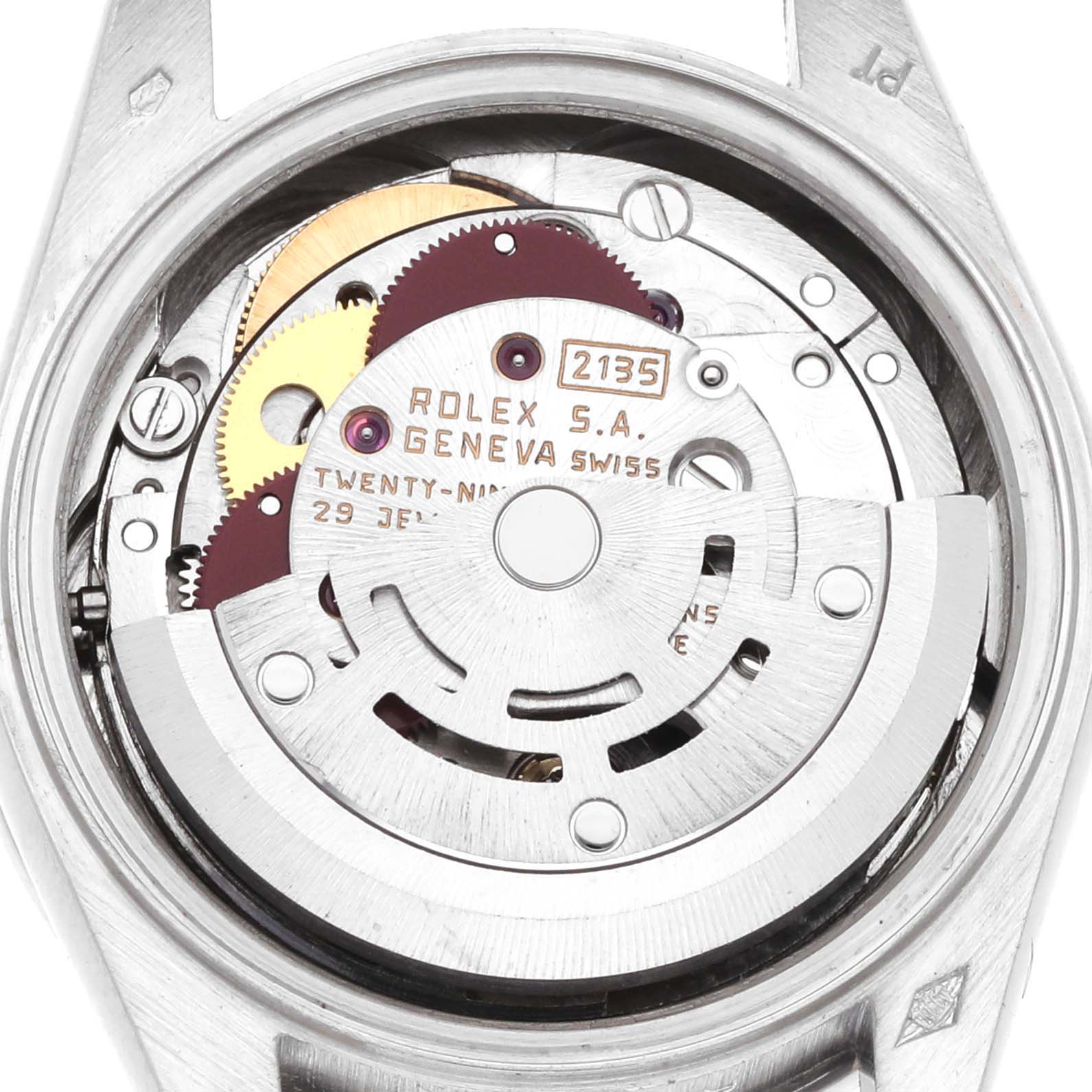 The image shows the movement of a Rolex President 69136 Men
s Platinum Silver Dial model from a top-down angle, displaying the intricate gears and inscriptions.