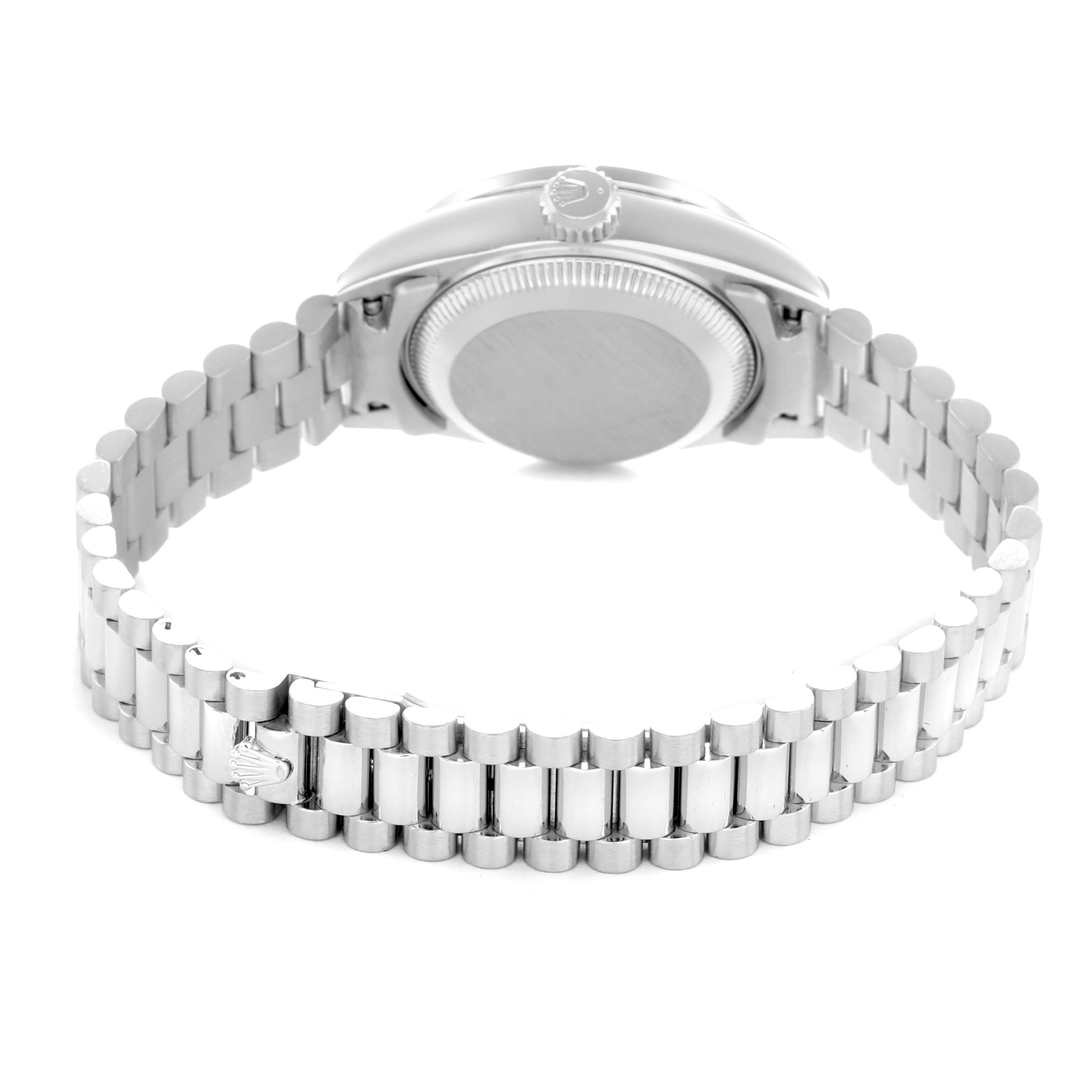 The image shows the back of the Rolex President 69136 Men
s Platinum Silver Dial watch, focusing on the bracelet and case back from behind.