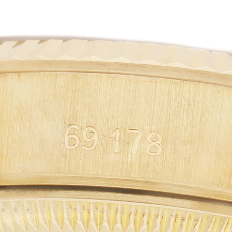 The image shows a close-up of the case side of a Rolex President 69178 Women
s Yellow Gold White Dial model, displaying the model number "69178."