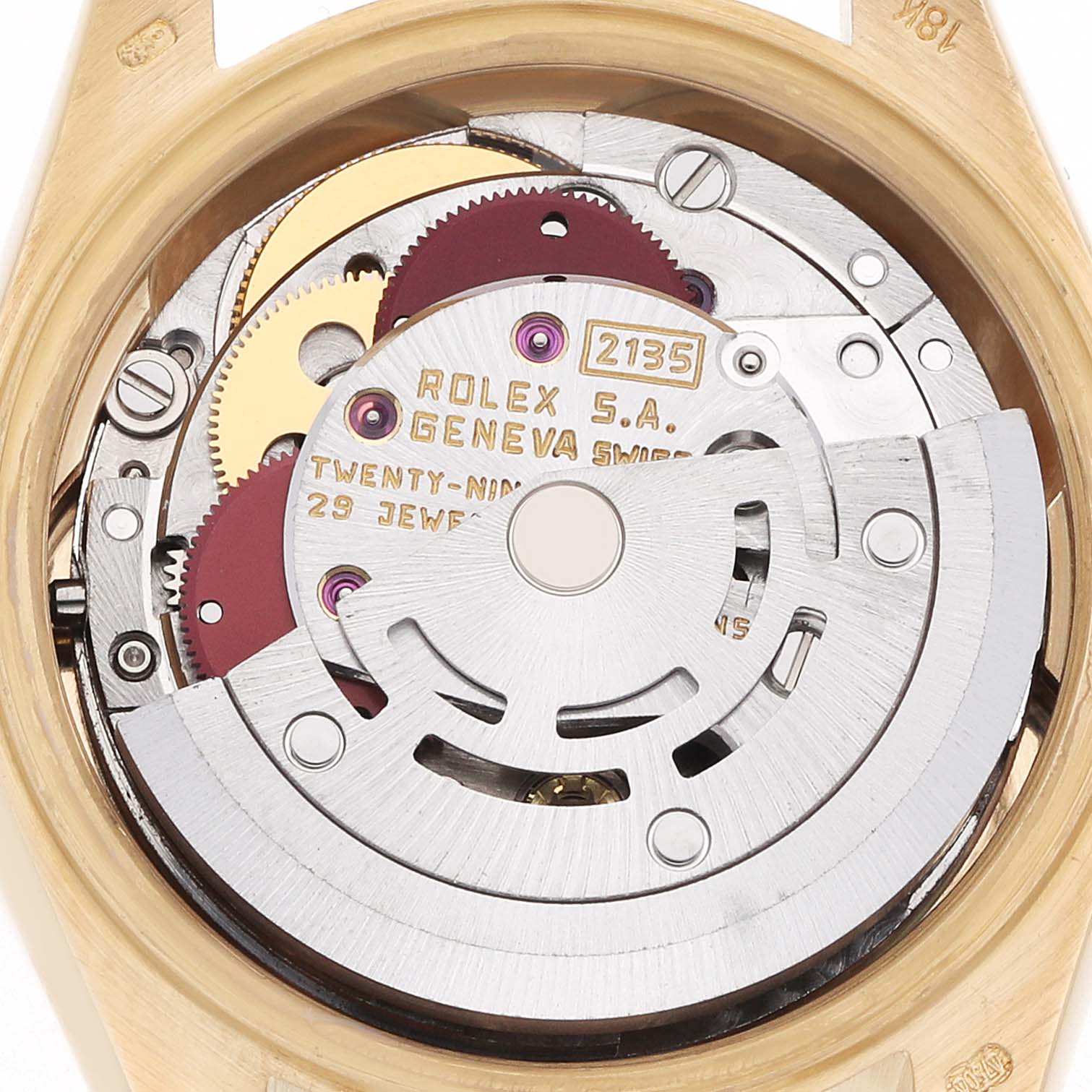 The image shows the movement mechanism of a Rolex President 69178 Women
s Yellow Gold White Dial watch from the back angle, highlighting gears and engravings.