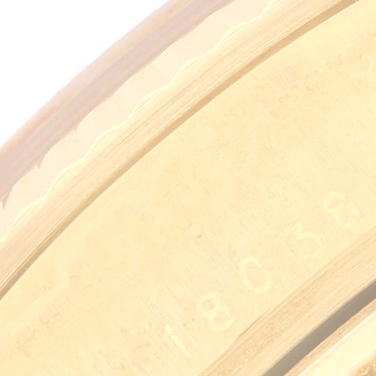 The close-up image shows the engraving on the inner bezel of a Rolex President 18038 Men
s Yellow Gold Champagne Dial 18038 Men
s Yellow Gold Champagne Dial model watch.