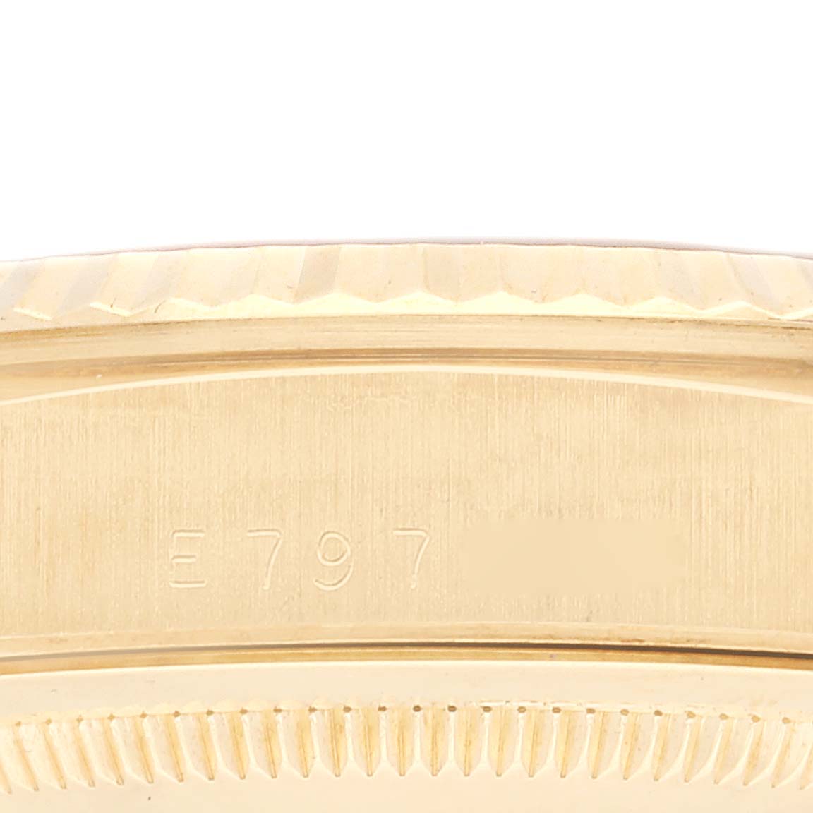 The image shows a close-up of the case edge and part of the fluted bezel of a Rolex President 18238 Men
s Yellow Gold Champagne Dial 18238 Men
s Yellow Gold Champagne Dial watch model.